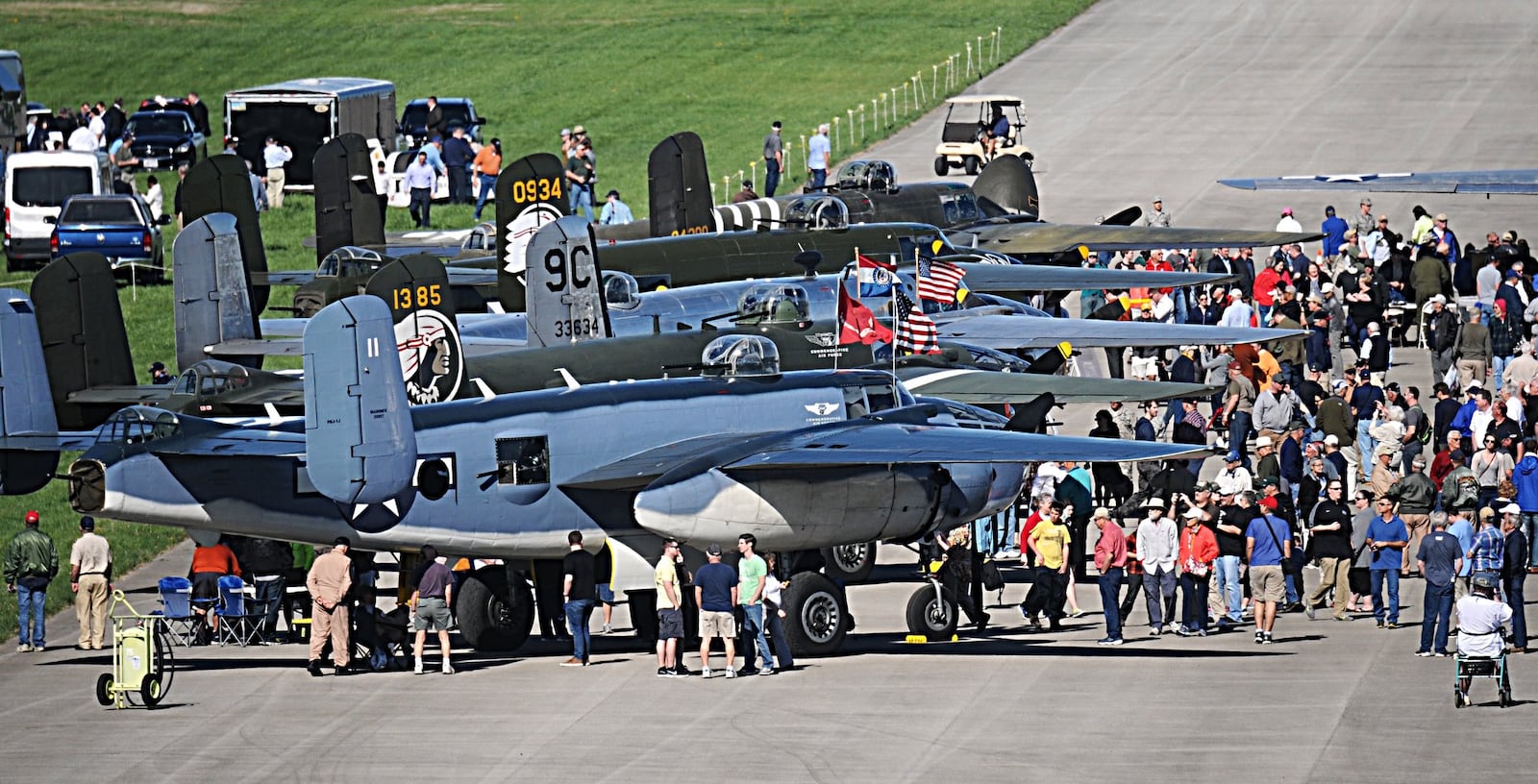 Spectators flocked to B-25s that landed at Wright-Patterson Air Force Base on Tuesday, April 18, 2017. The planes came to the National Museum of the United States Air Force as part of a celebration of the 75th anniversary of the Doolittle Raiders mission against Japan. MARSHALL GORBY / STAFF