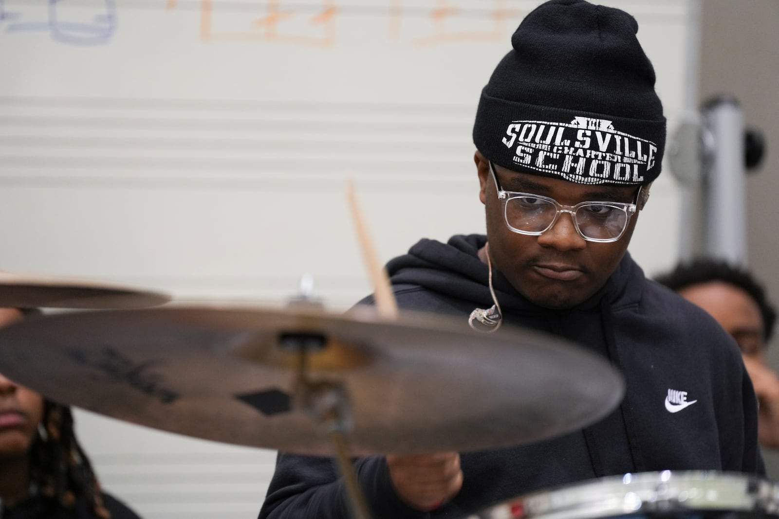 Christian Gillespie plays the drums during rehearsal at the Stax Music Academy, Thursday, Jan. 30, 2025, in Memphis, Tenn. (AP Photo/George Walker IV)