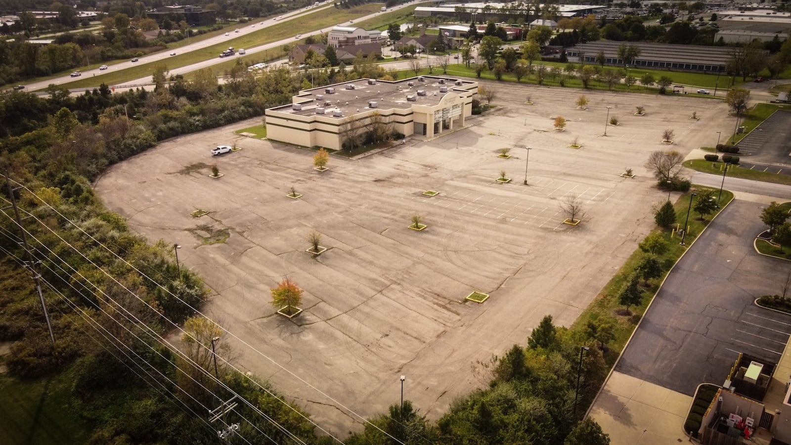 A photograph of the former Danbarry Cinemas building in Miami Twp. taken in October 2021. Kenwood Lincoln-Mercury LLC bought the former Danbarry Cinemas building along with about eight acres at 8300 Lyons Ridge Rd. in Miami Twp. earlier that year. JIM NOELKER/STAFF