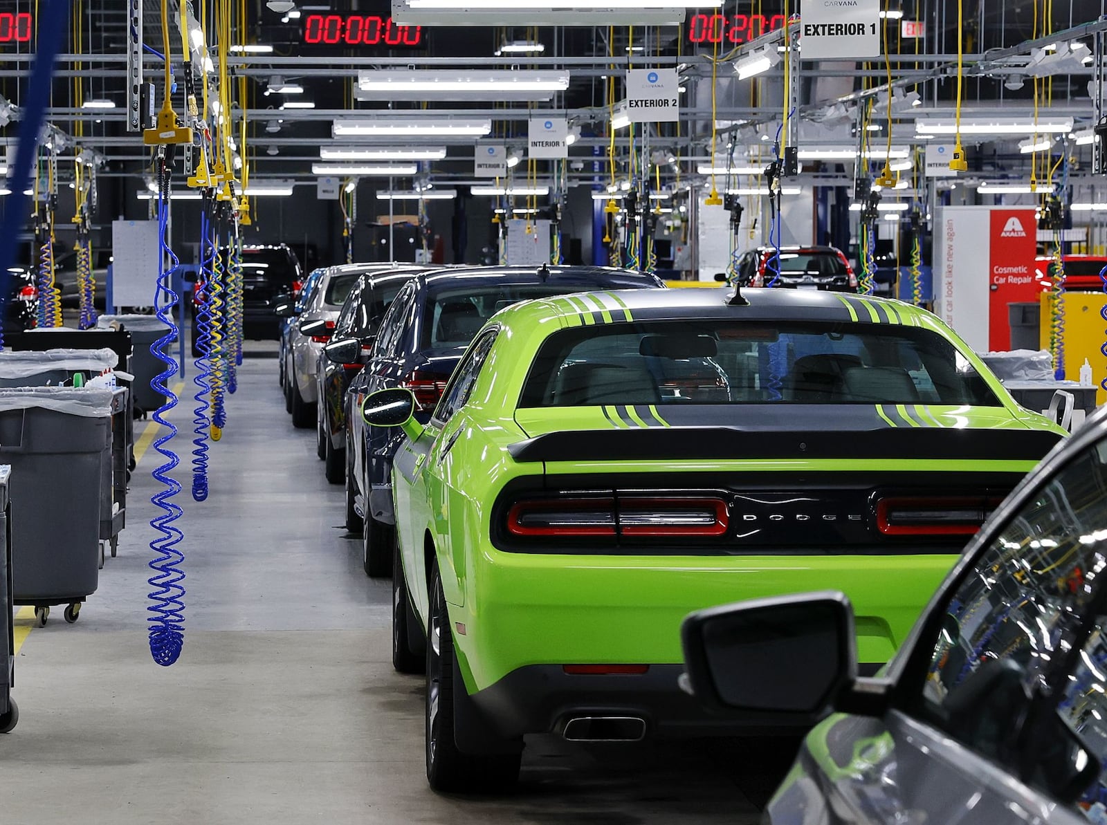 Cars go through a 150-point inspection before they're listed for sale on-line by Carvana. NICK GRAHAM/STAFF