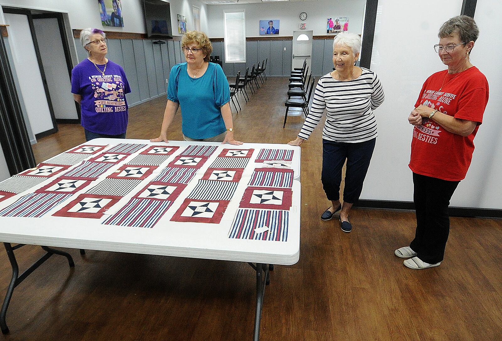 These ladies from left, Sarah Shell, Mary Guehl, Donna Alexander and Marsha Thornburg, volunteer to sew quilts for Quilts of Valor for veterans. The group meets on Thursdays at the Earl Hack Community Center in Englewood. MARSHALL GORBY\STAFF