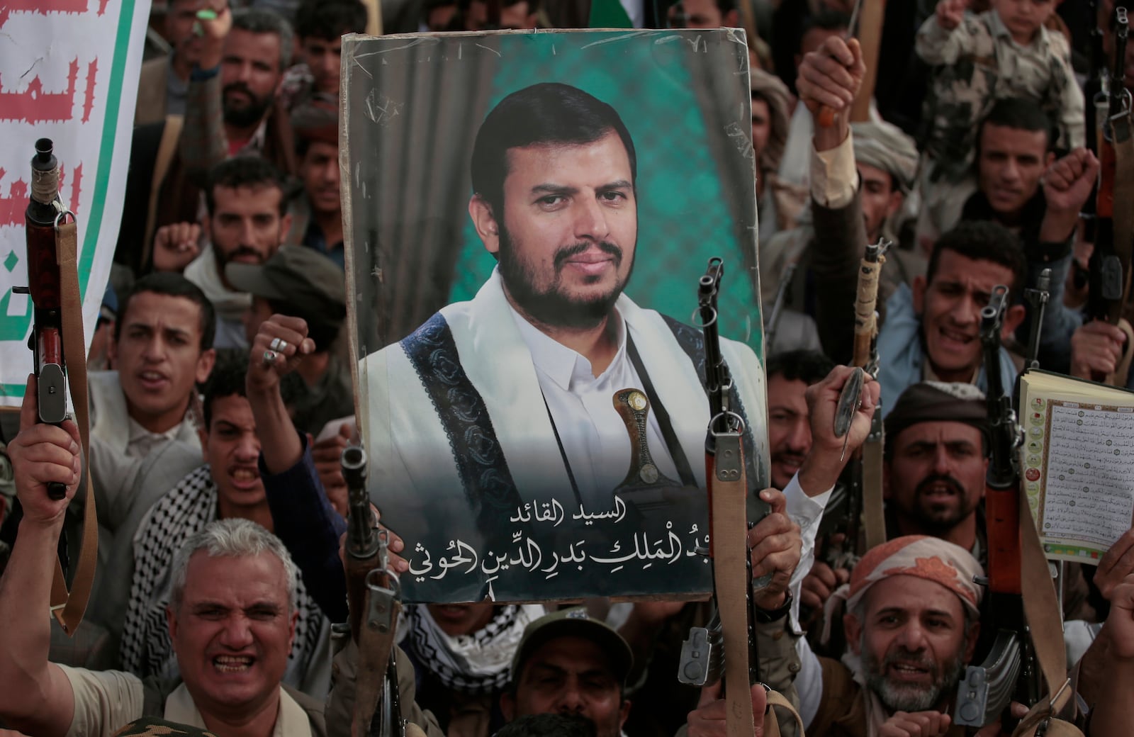 Houthi supporters chant slogans and hold pictures of Abdul Malik al-Houthi, the leader of the Houthi movement, during an anti-U.S. and anti-Israel rally in Sanaa, Yemen, Monday, March 17, 2025. (AP Photo/Osamah Abdulrahman)