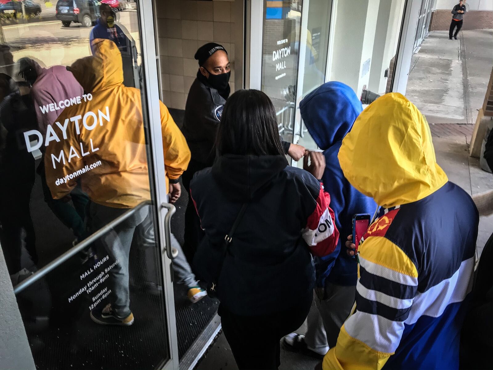 Around 300 people went shopping Tuesday morning at the Dayton Mall. The doors opened at 11 a.m. for 50 people waiting at the doors. About half the stores appeared to be open and about half the shoppers in the mall were wearing masks. JIM NOELKER/STAFF