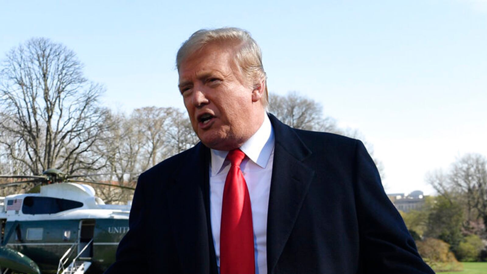 President Donald Trump talks with reporters before boarding Marine One on the South Lawn of the White House in Washington, Thursday, March 28, 2019, for the short trip to Andrews Air Force Base in Maryland. Trump said he has overridden the proposed Special Olympics funding cut.