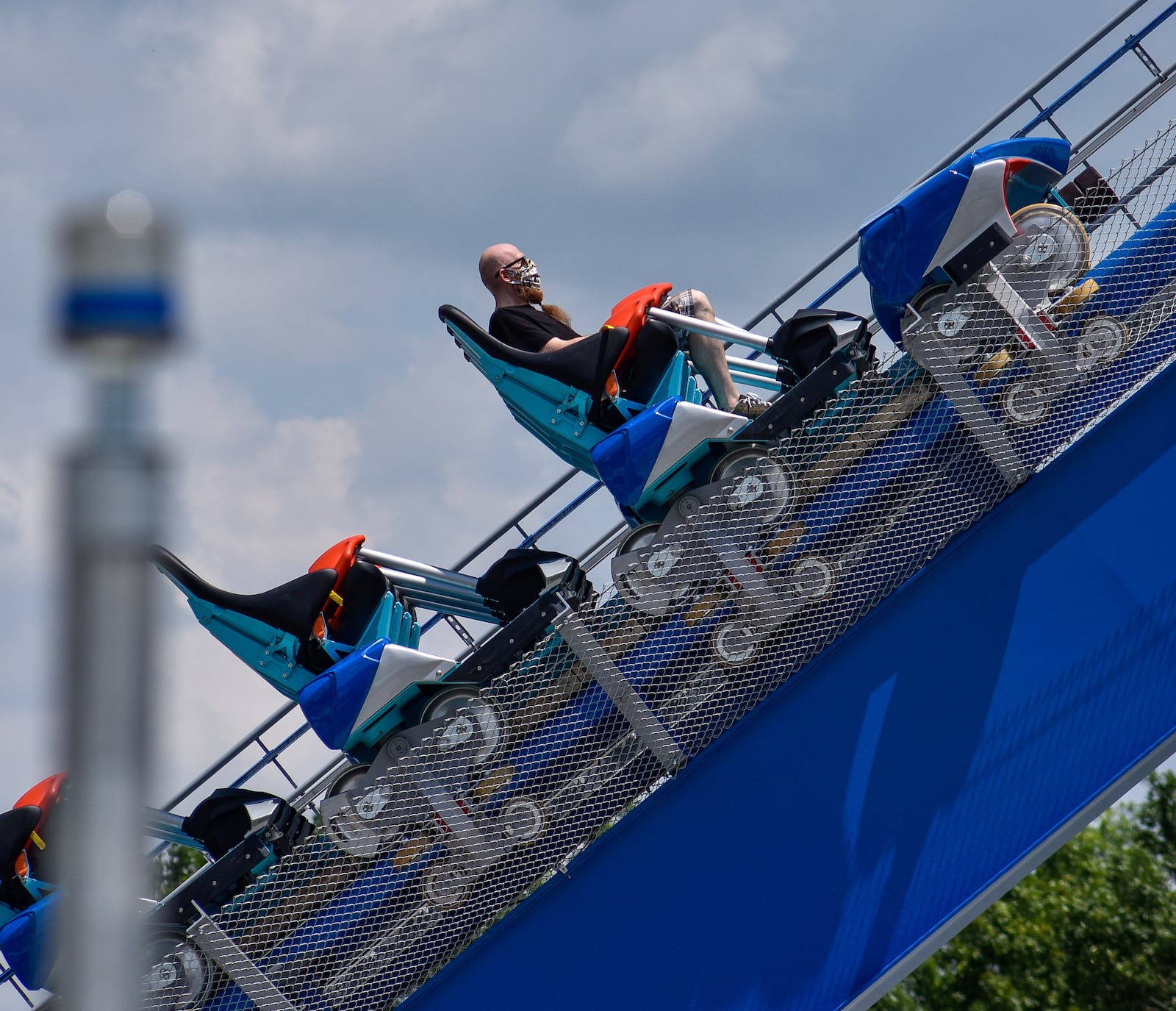 Coaster enthusiast Jared Ream rides the new Orion giga coaster on July 1 at Kings Island in Mason. Ream lost 190 pounds, motivated by his desire to ride this coaster. NICK GRAHAM/STAFF