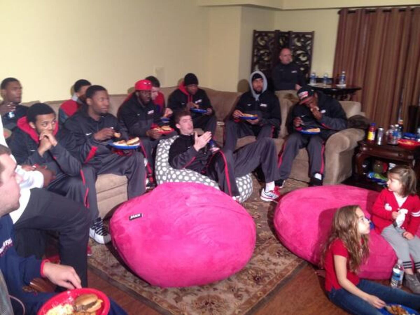 The Dayton Flyers waiting for selection show in Coach Archie Miller's house.