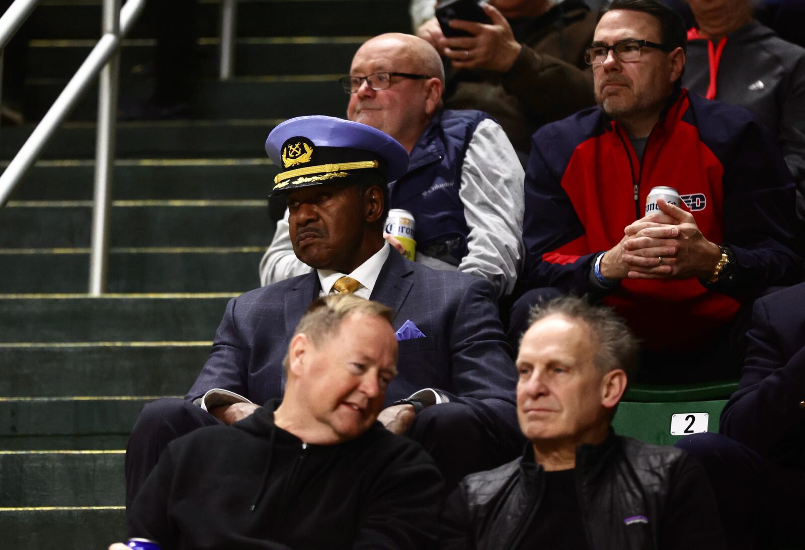 Former Flyer J.D. Grigsby watches Dayton play George Mason on Feb. 21, 2024, at EagleBank Arena in Fairfax, Va. David Jablonski/Staff