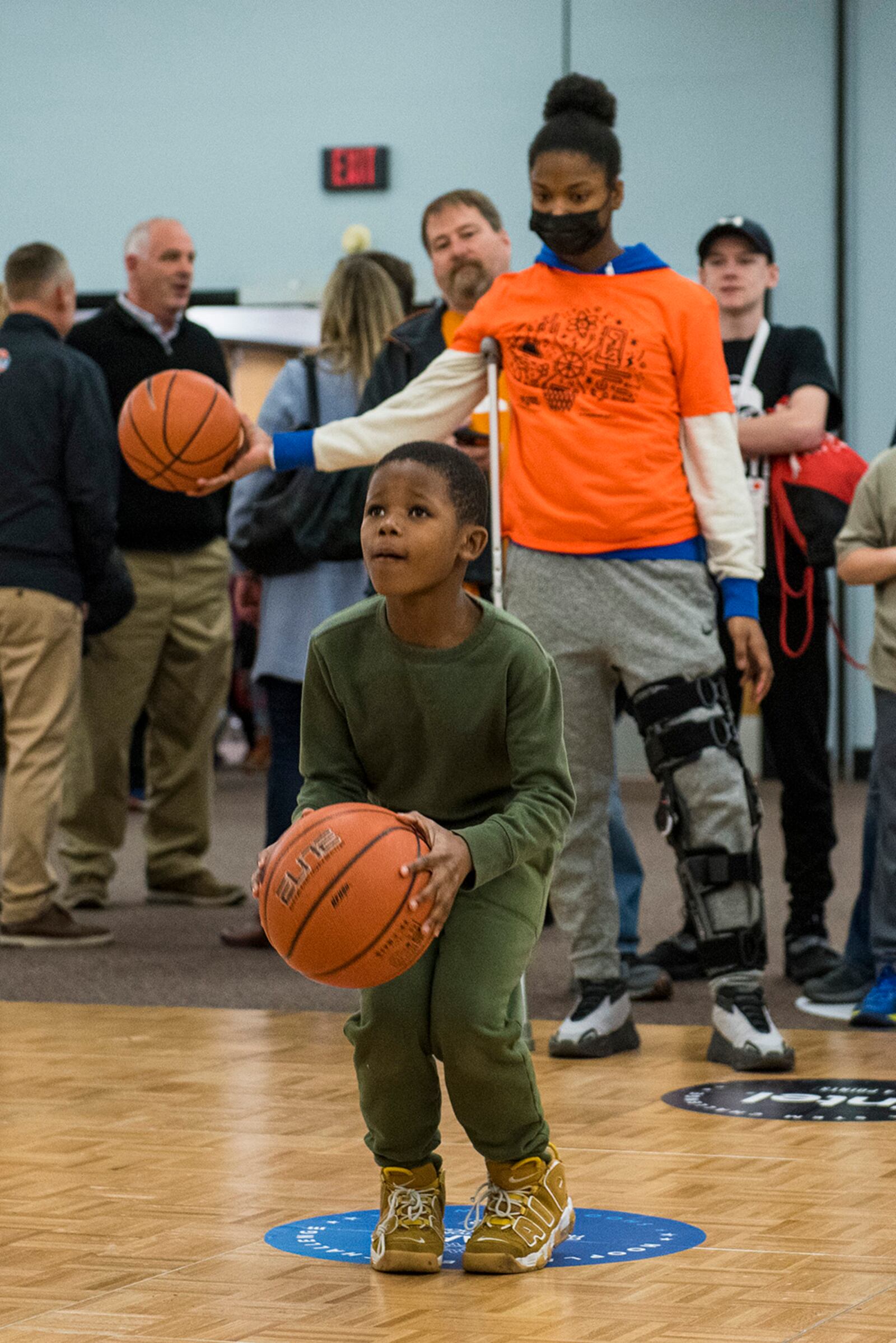 A boy prepares to shoot during the Big Hoopla STEM Challenge’s “hot shot” event March 13 at Dayton Convention Center. The event’s goal was to tie together the excitement of college basketball and power of STEM education. U.S. AIR FORCE PHOTO/JAIMA FOGG