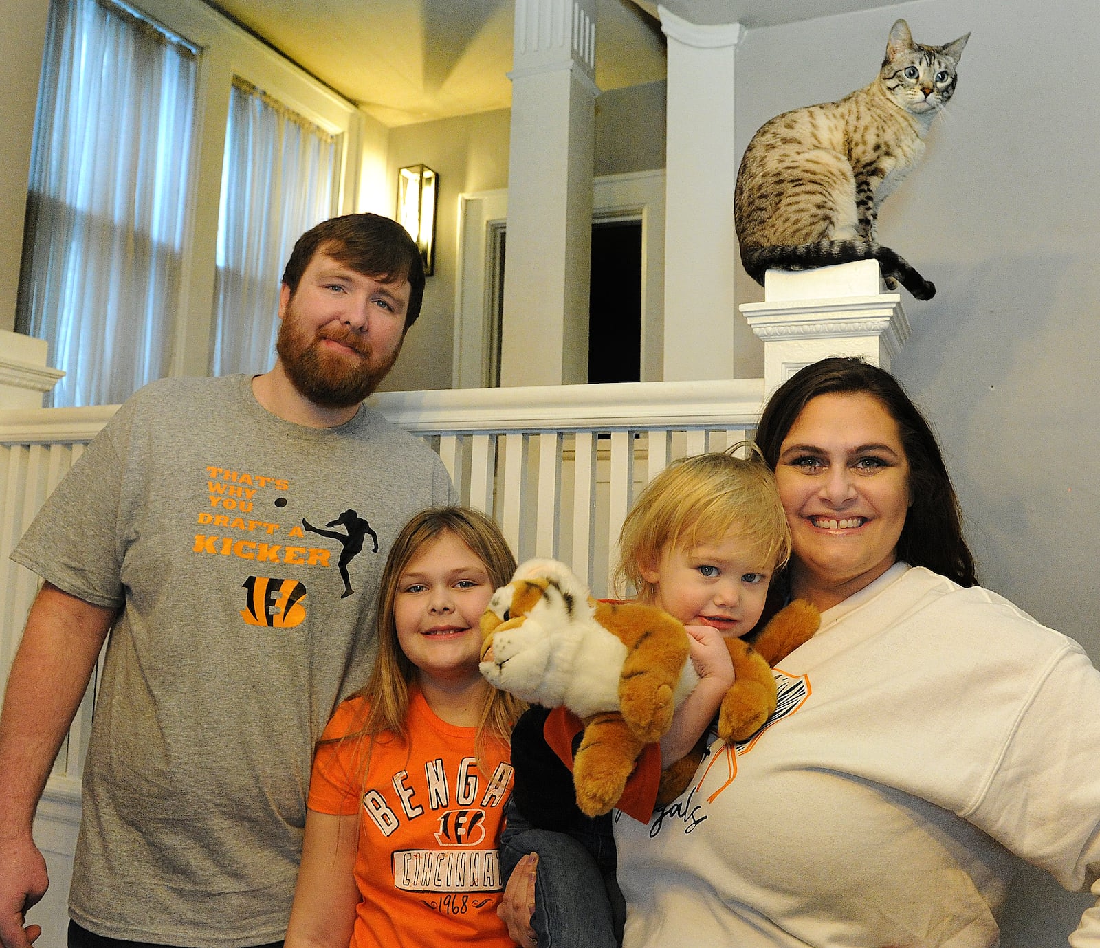 The Young family of Piqua: from left, Brandon, Lily, 9; Ivy, 2; and Melissa, are lifelong fans of the Cincinnati Bengals. MARSHALL GORBY/STAFF