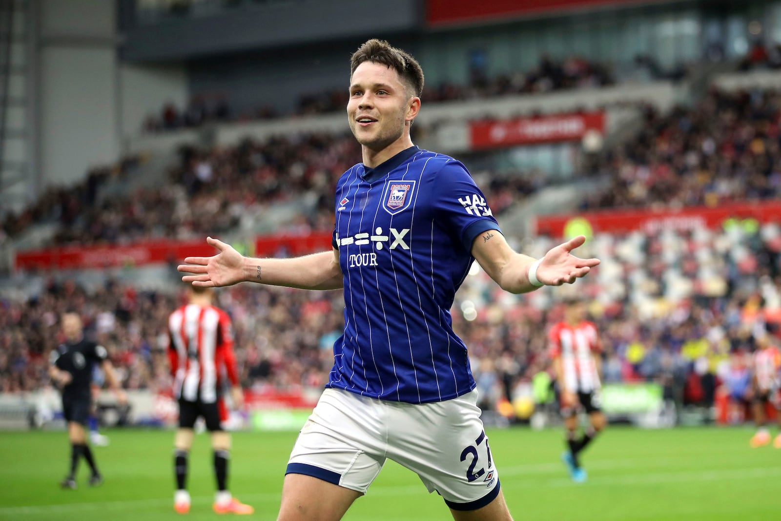 Ipswich Town's George Hirst celebrates scoring hia side's second goal of the game, during the English Premier League soccer match between Brentford and Ipswich Town, at the Gtech Community Stadium, in London, Saturday, Oct. 26, 2024. (Rhianna Chadwick/PA via AP)