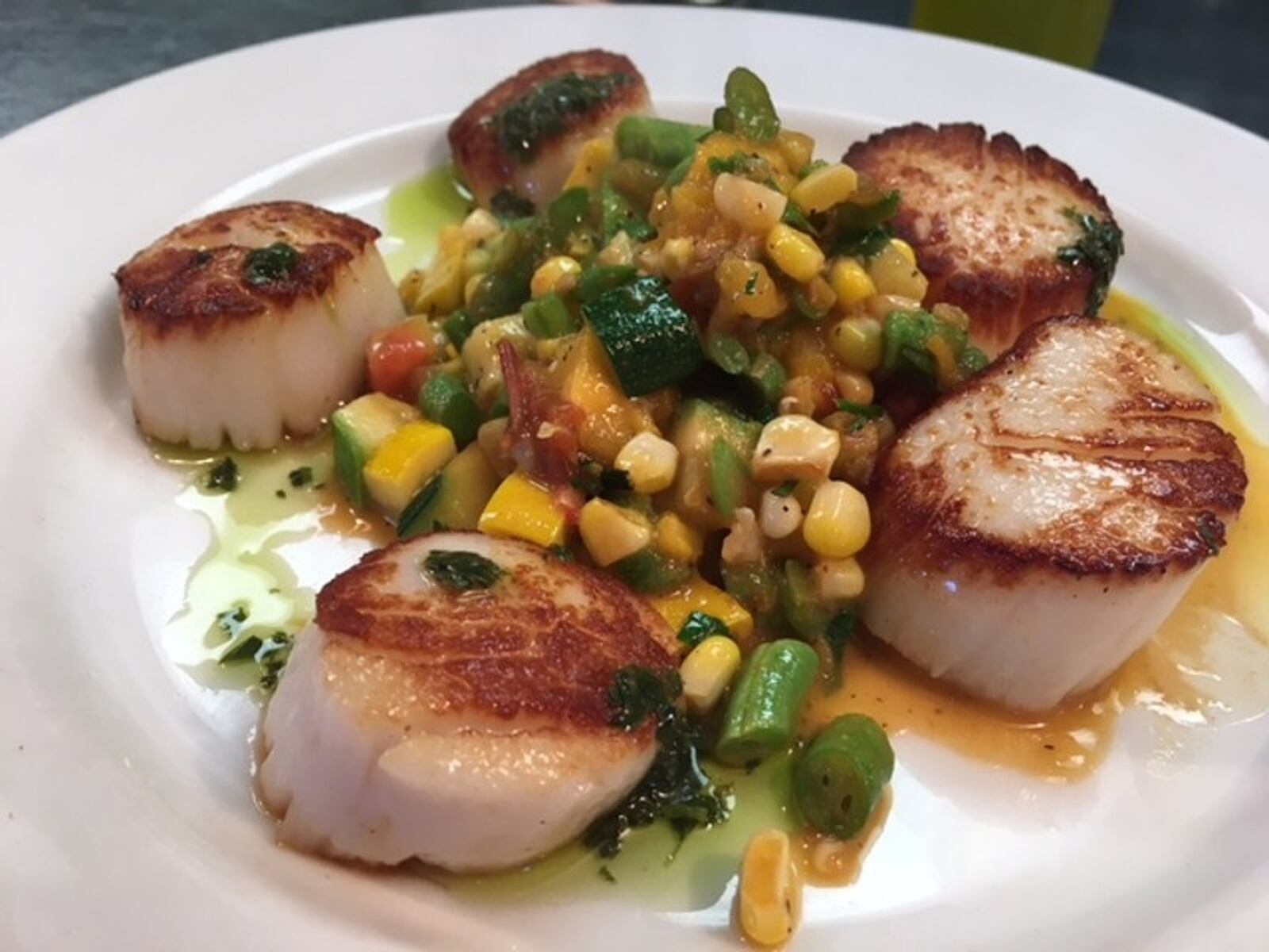 Pan-seared scallops at Corner Kitchen. CONTRIBUTED