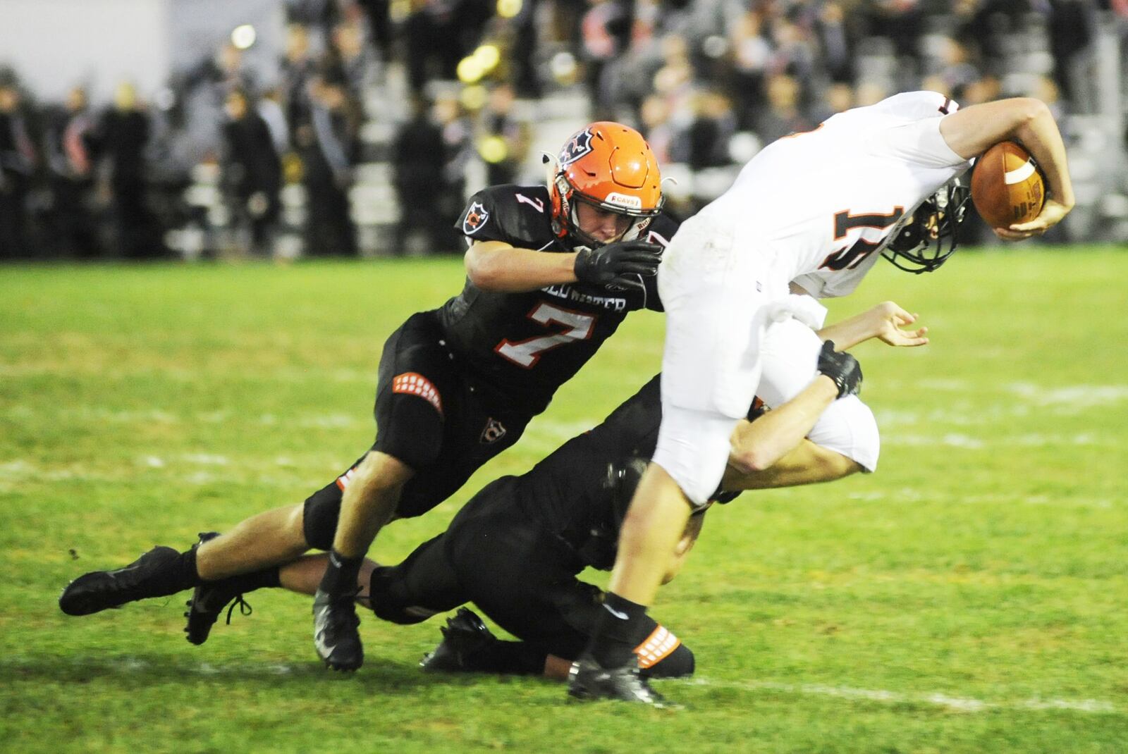 Coldwater’s Myles Blasingame (7) takes down Minster QB Jacob Niemeyer. Coldwater defeated visiting Minster 31-20 in a Week 4 high school football game on Friday, Sept. 14, 2018. MARC PENDLETON / STAFF