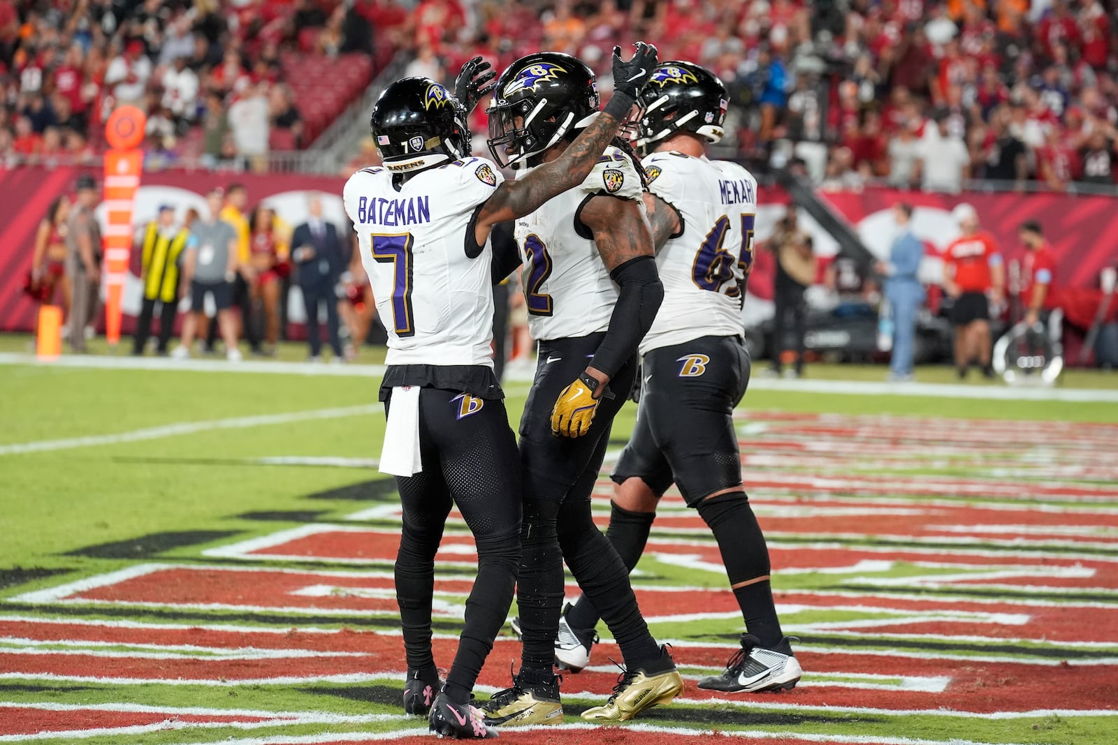 Baltimore Ravens wide receiver Rashod Bateman (7) celebrates with running back Derrick Henry (22) after Henry's passing touchdown during the second half of an NFL football game against the Tampa Bay Buccaneers, Monday, Oct. 21, 2024, in Tampa, Fla. (AP Photo/Chris O'Meara)