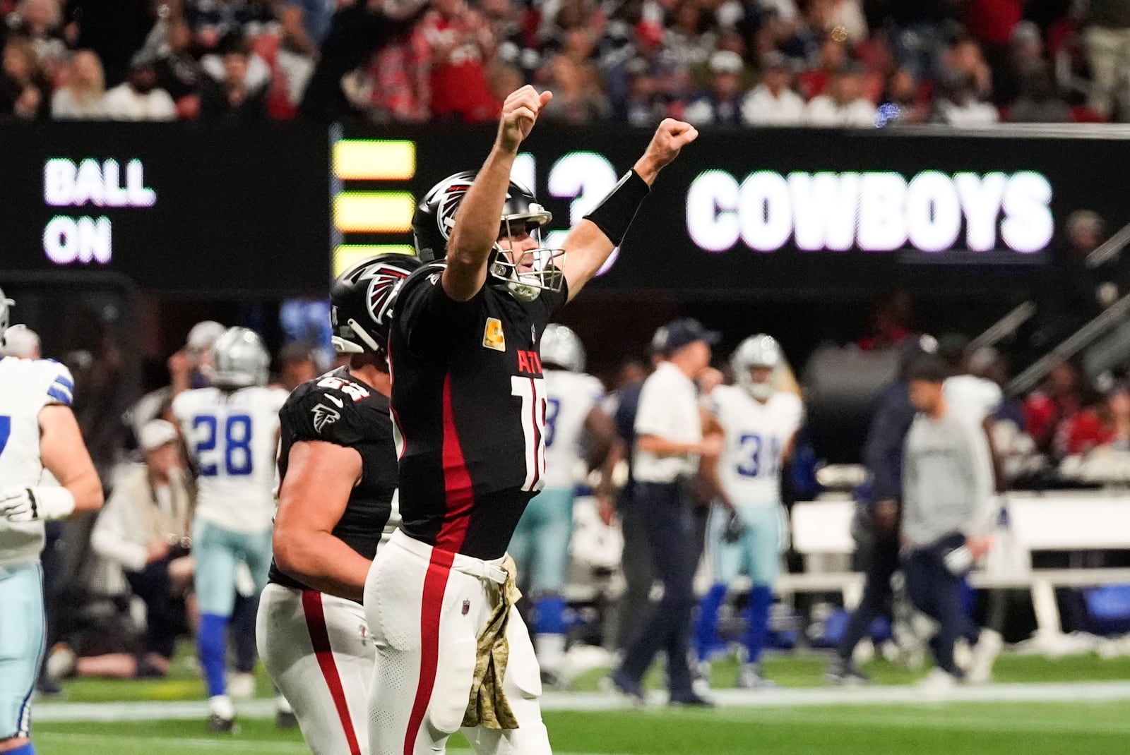 Atlanta Falcons quarterback Kirk Cousins (18) celebrates after a touchdown during the second half of an NFL football game against the Dallas Cowboys, Sunday, Nov. 3, 2024, in Atlanta. (AP Photo/ John Bazemore)