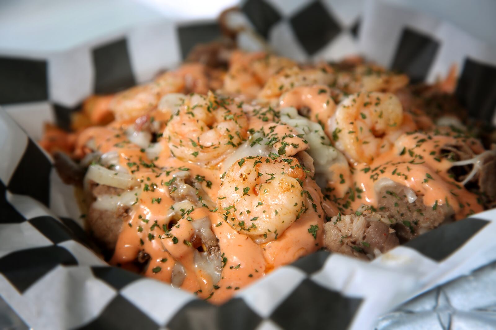 Steak and Shrimp Fries are the specialty at T's Heavenly Taste, a food truck founded by Terri Gates in 2018.  Hand-cut fries are topped with steak, shrimp, green and red peppers, onions, cheese sauce and homemade seafood sauce. LISA POWELL / STAFF