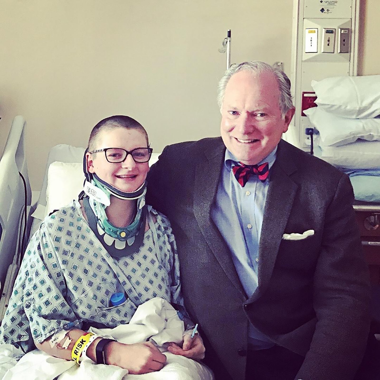 Elson (Left) at age 22 with neurosurgeon, Dr. Fraser Henderson after surgery in 2018 at Doctors Community Medical Center in Maryland.