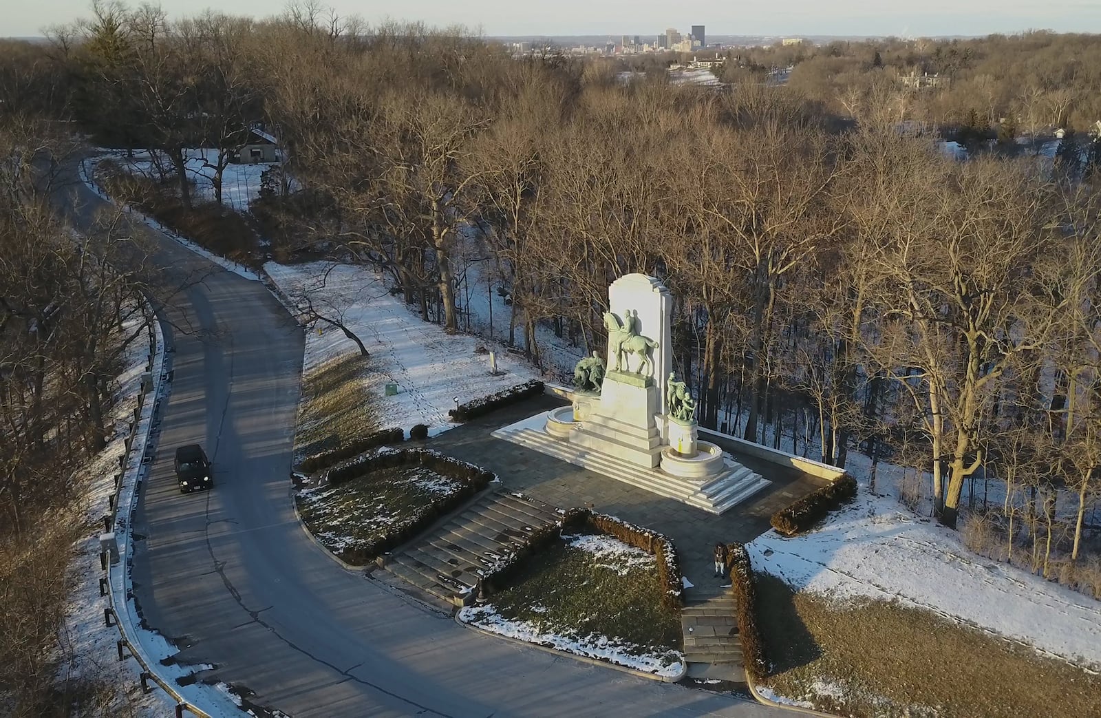 John H. Patterson, co-founder of NCR, believed education, recreation and outdoor exercise were the pillars of good health. A memorial to Patterson was erected in the 1920s and stands in the heart of Hills & Dales MetroPark in Kettering.  The City of Dayton skyline is at the top.  ERIC DIETRICH / STAFF