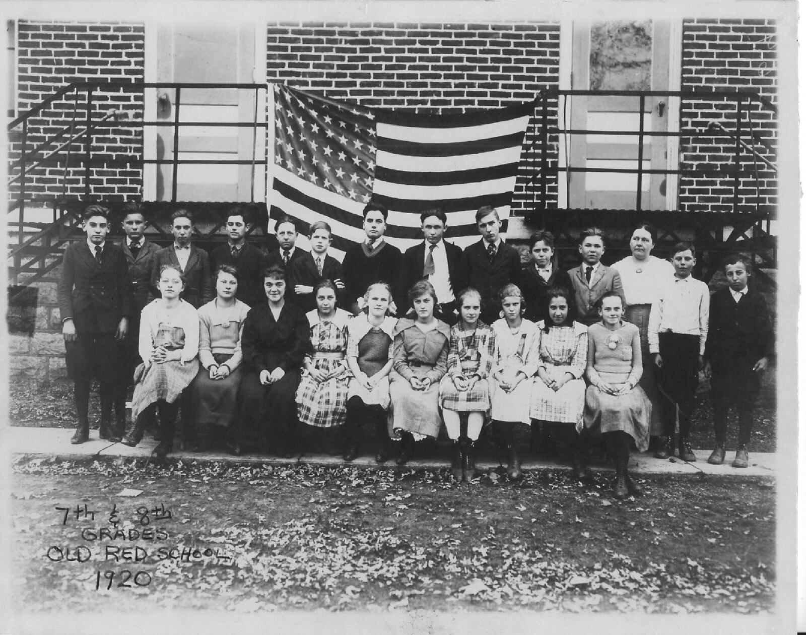 Springboro school students pose for a photo  in 1920. The teacher was Miss Clevenger and the handwritten title  on the photo reads Old Red School. This building was torn down to make way for the present Jonathan Wright Elementary. 