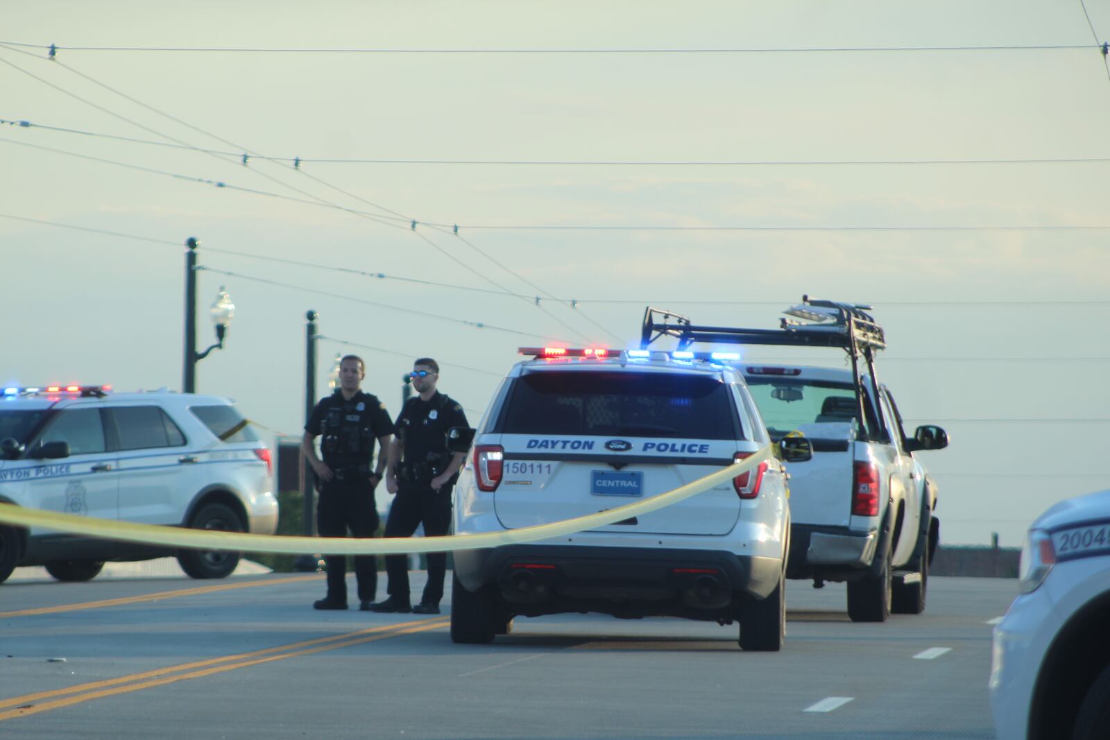 Dayton police respond to a traffic crash on the Third Street Bridge. CORNELIUS FROLIK / STAFF