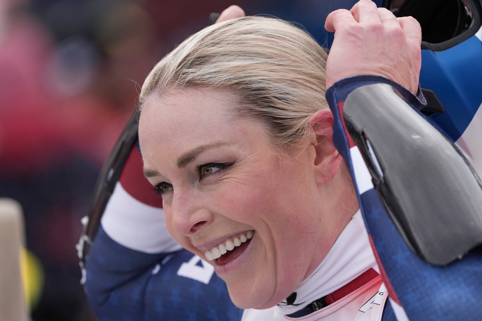 United States Lindsey Vonn reacts after completing an alpine ski, women's World Cup super G race, in St. Anton, Austria, Sunday, Jan. 12, 2025. (AP Photo/Giovanni Auletta)