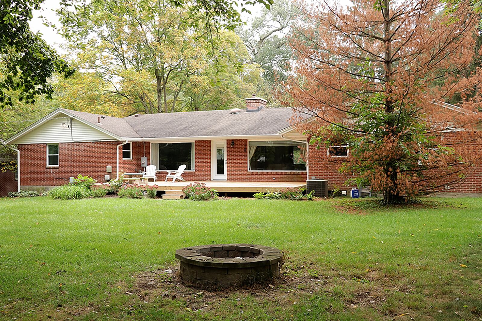 A single door opens off the dining area to a wooden deck and the park-like back yard. CONTRIBUTED PHOTO BY KATHY TYLER