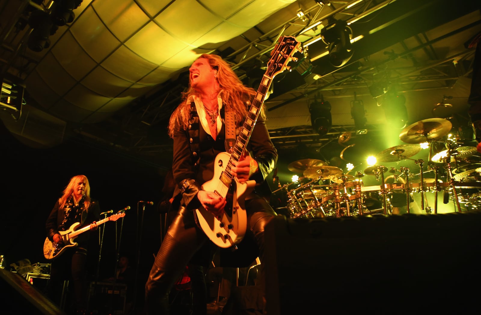 NEW YORK, NY - NOVEMBER 17:  Guitarists Chris Caffery (L) and Joel Hoekstra of Trans-Siberian Orchestra perform onstage during an exclusive performance at The iHeartRadio Theater in New York at iHeartRadio Theater on November 17, 2014 in New York City.  (Photo by Anna Webber/Getty Images for iHeart Radio)