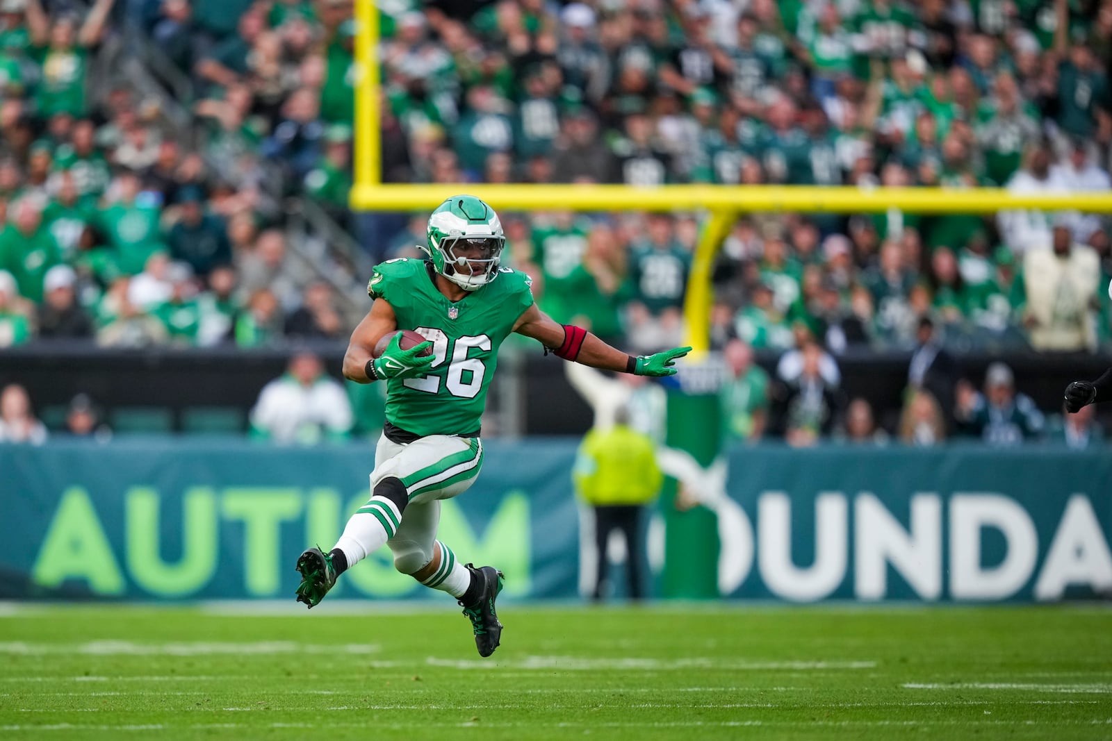 Philadelphia Eagles running back Saquon Barkley (26) runs the ball against the Dallas Cowboys during the second half of an NFL football game, Sunday, Dec. 29, 2024, in Philadelphia. (AP Photo/Matt Slocum)