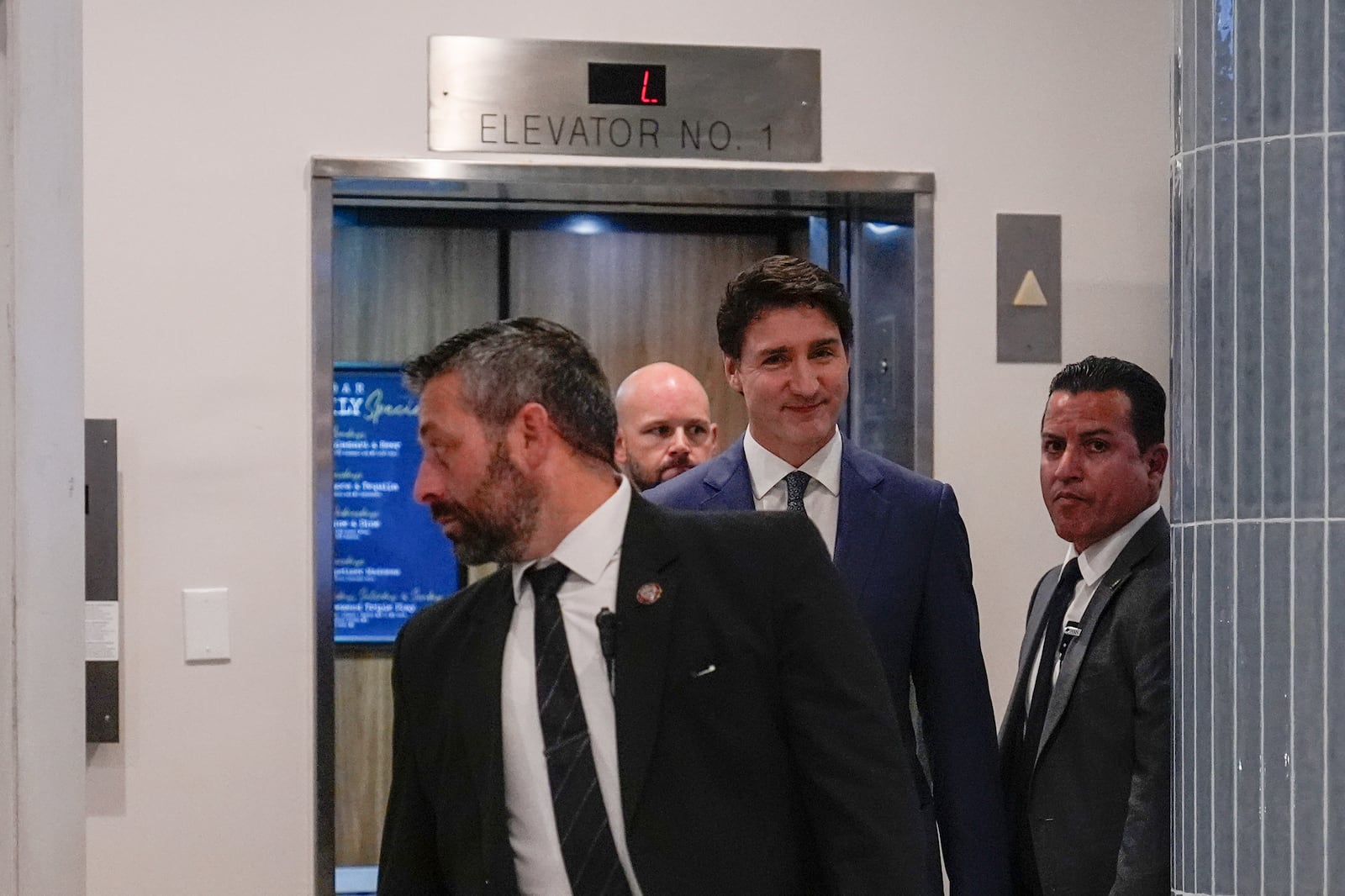 Canadian Prime Minister Justin Trudeau walks through the lobby of the Delta Hotel by Marriott, Friday, Nov. 29, 2024, in West Palm Beach, Fla. (AP Photo/Carolyn Kaster)