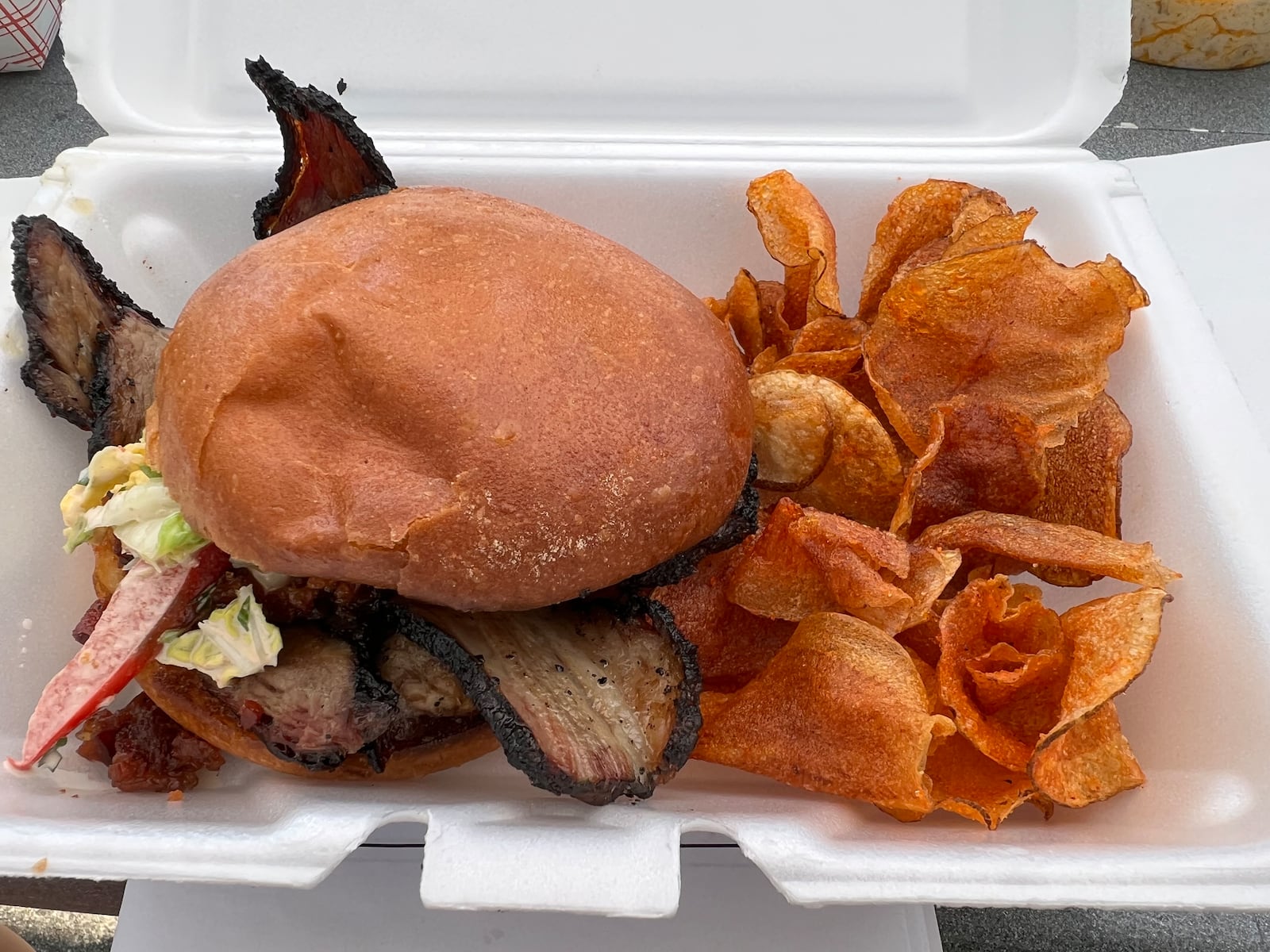 Coco’s Bistro's smoked brisket sandwich with bacon jam and housemade potato chips. ALEXIS LARSEN/CONTRIBUTOR