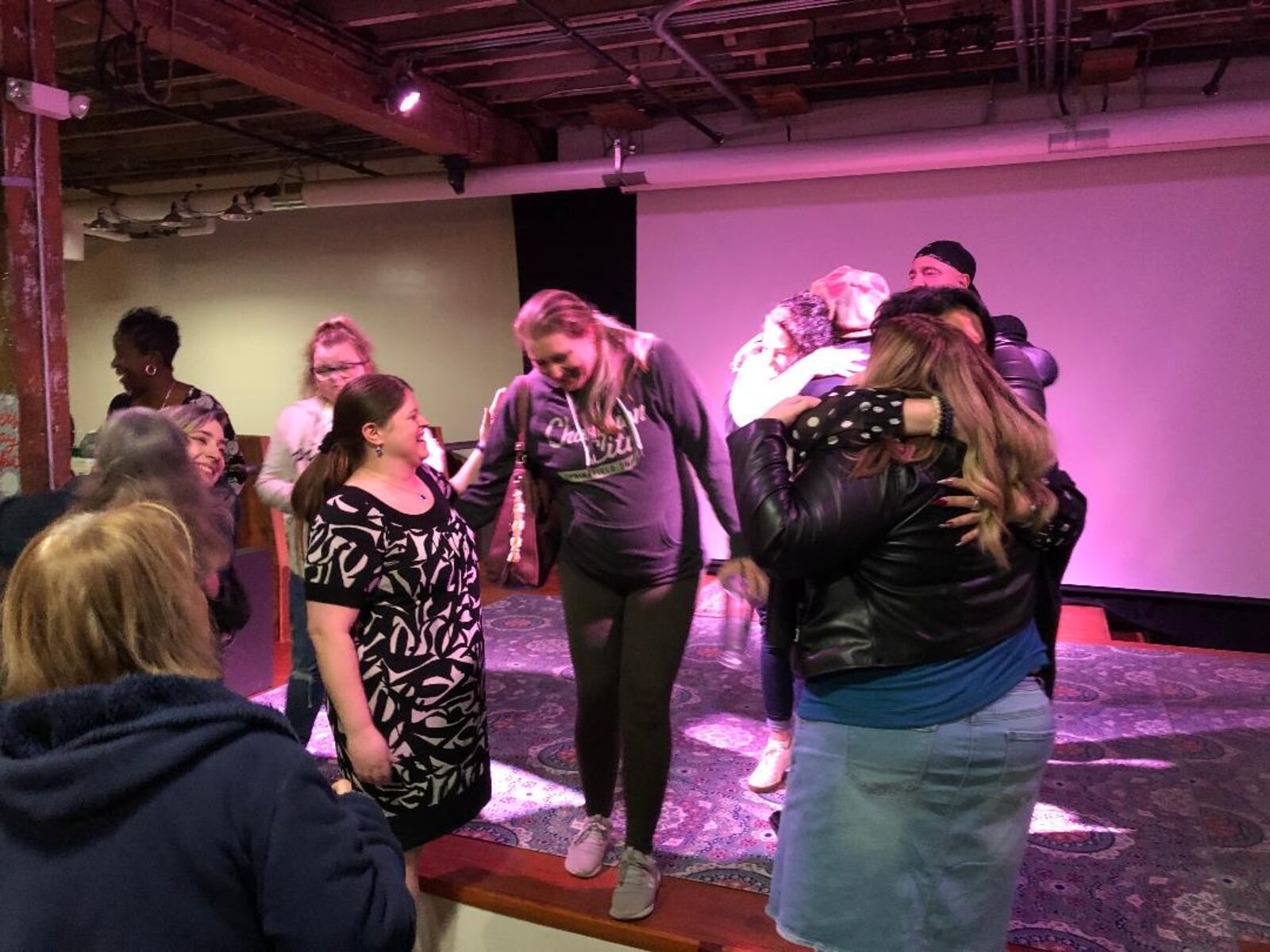 Plenty of hugs and smiles accompanied the reunion of community members who participated in the making of "Finding Harmony," a pilot film that premiered on ABC TV on Wednesday evening.