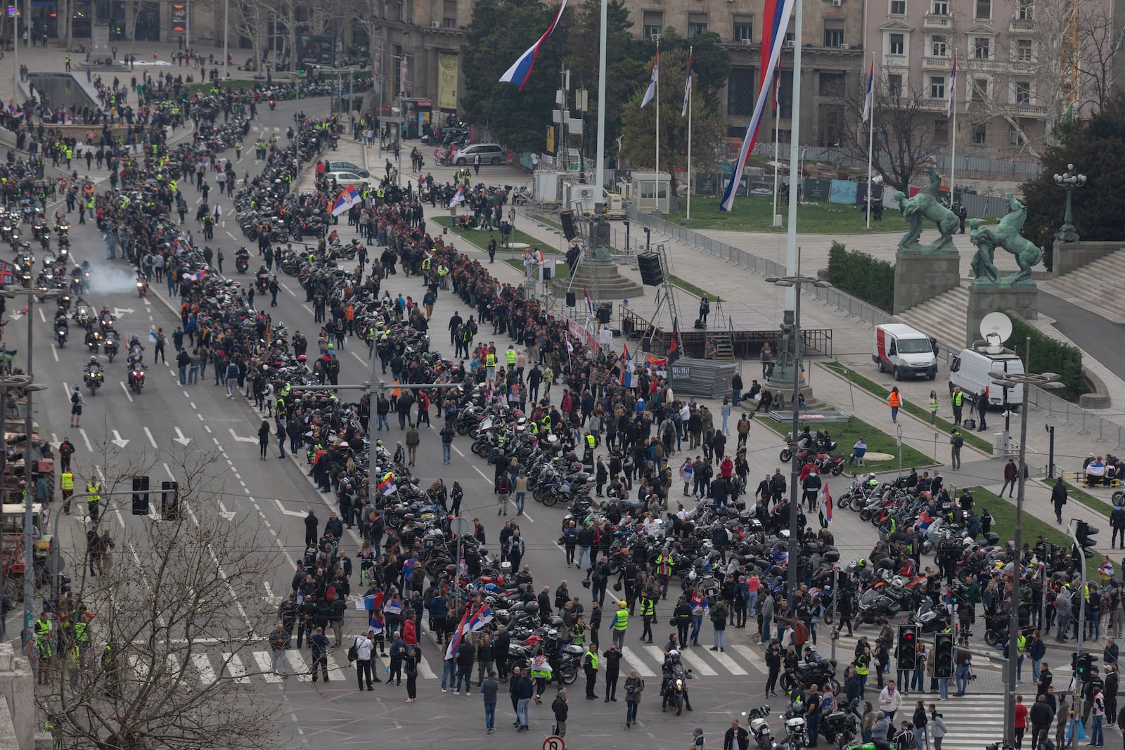 Hundreds of bikers gather in front of the Serbian parliament during a major anti-corruption rally led by university students in Belgrade, Serbia, Saturday, March 15, 2025. (AP Photo/Marko Drobnjakovic)