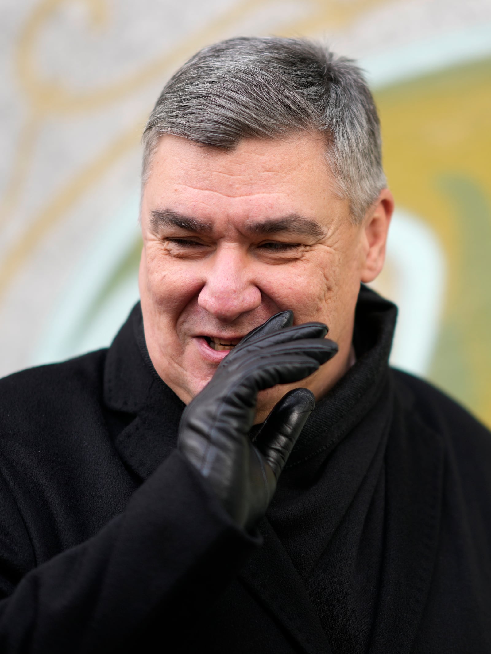 President incumbent Zoran Milanovic talks to media after casting his ballot during a runoff vote for the Croatian presidential election at a polling station in Zagreb, Croatia, Sunday, Jan. 12, 2025. (AP Photo/Darko Bandic)