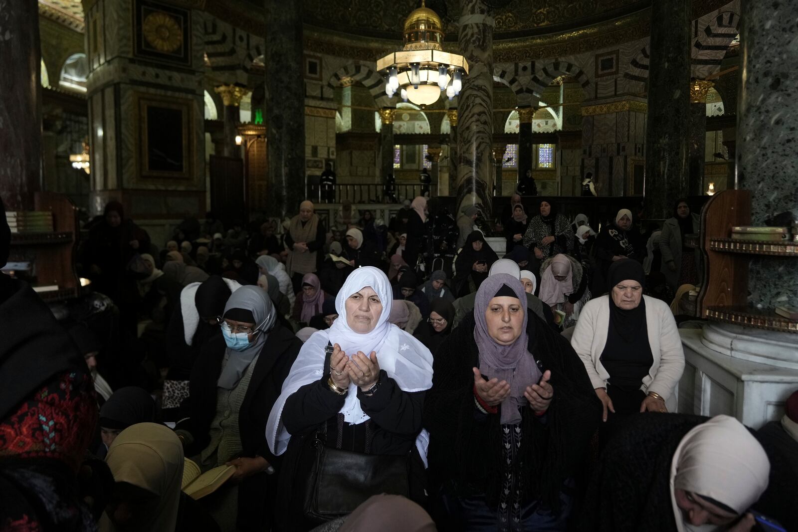 Women pray at the Al-Aqsa Mosque compound during the first Friday Prayers of the Muslim holy month of Ramadan in the Old City of Jerusalem, Friday, March 7, 2025. (AP Photo/Mahmoud Illean)