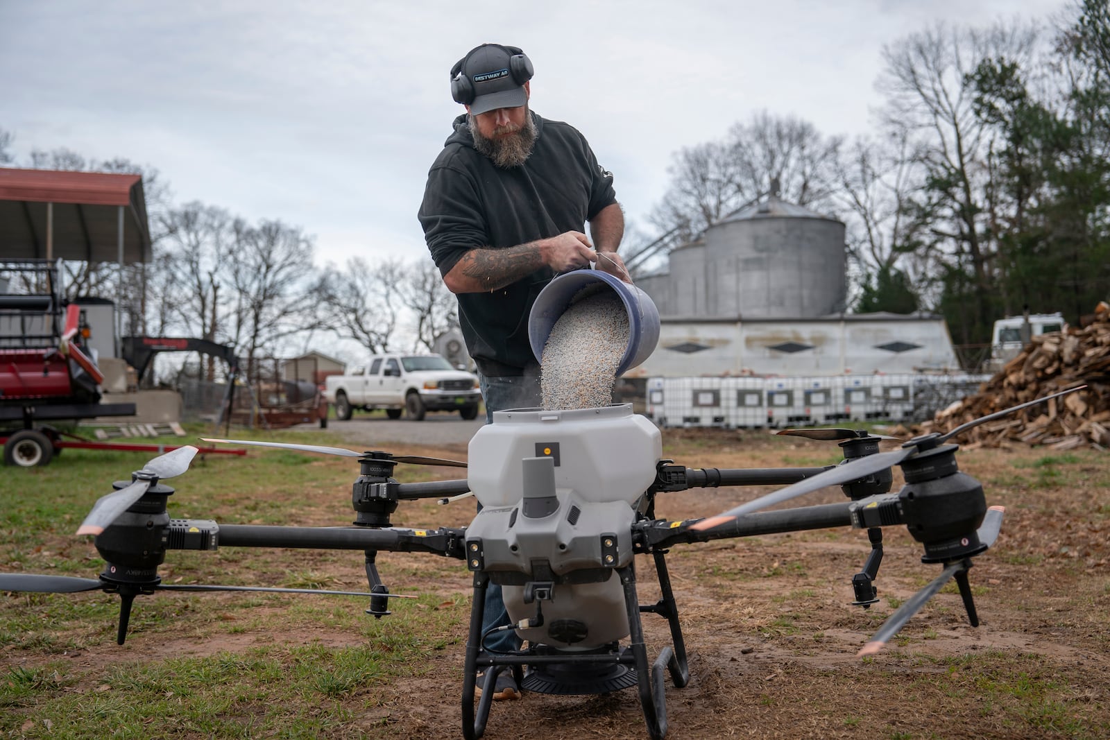 Russell Hedrick prepares a DJI drone to put crop cover on his farm, Tuesday, Dec. 17, 2024, in Hickory, N.C. (AP Photo/Allison Joyce)