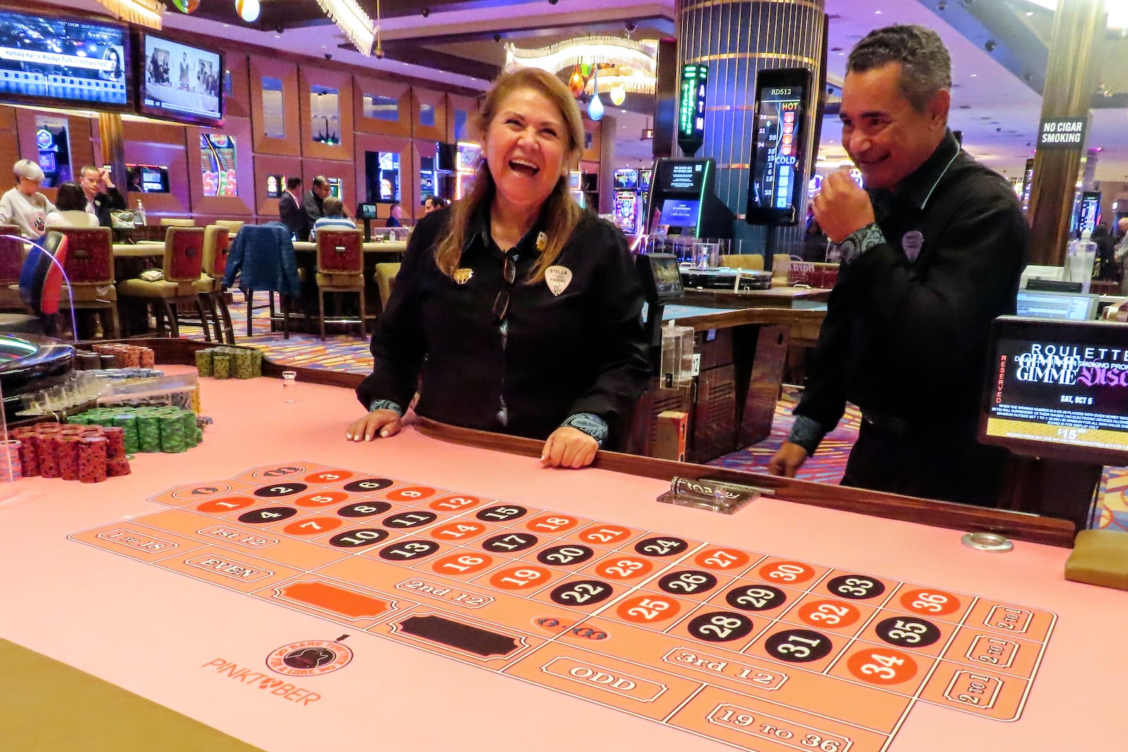 Dealers at a roulette table wait for customers at the Hard Rock casino in Atlantic City, N.J., Thursday, Oct. 3, 2024. (AP Photo/Wayne Parry)