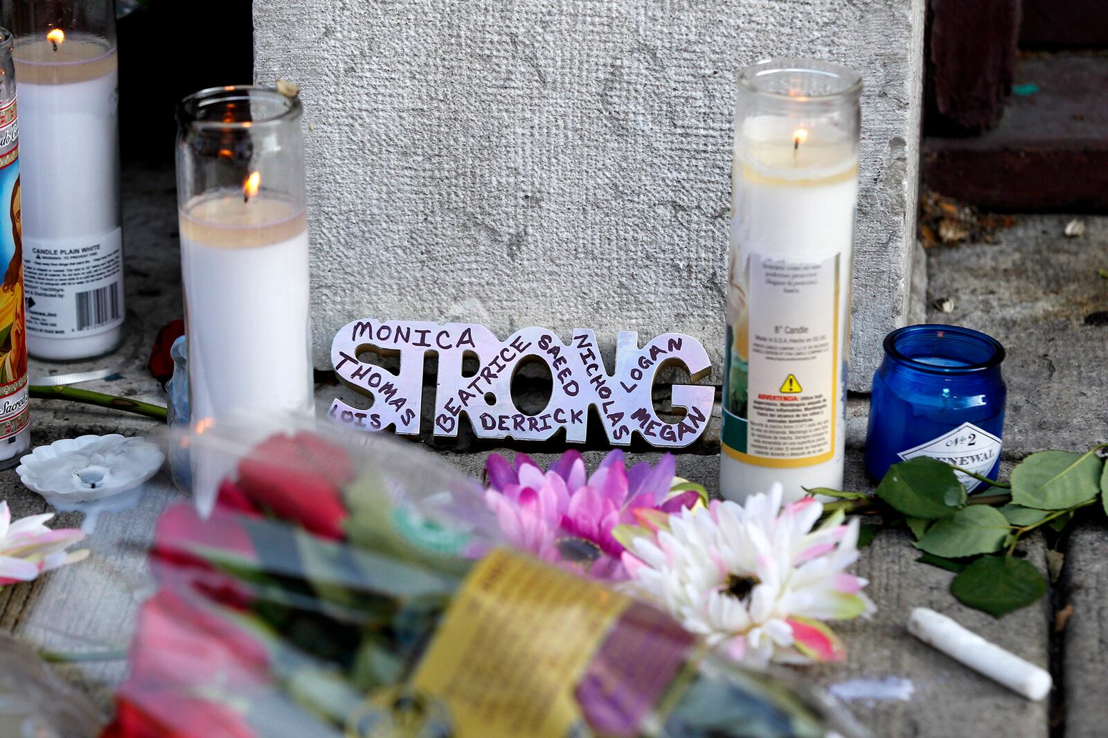 Memorials to the Dayton shooting victims and dozens of media workers filled the sidewalks of the Oregon District on Monday morning in the wake of ten people being killed, including the shooter, and more than two dozen injured at 1:00 A.M. on Sunday morning.  TY GREENLEES / STAFF