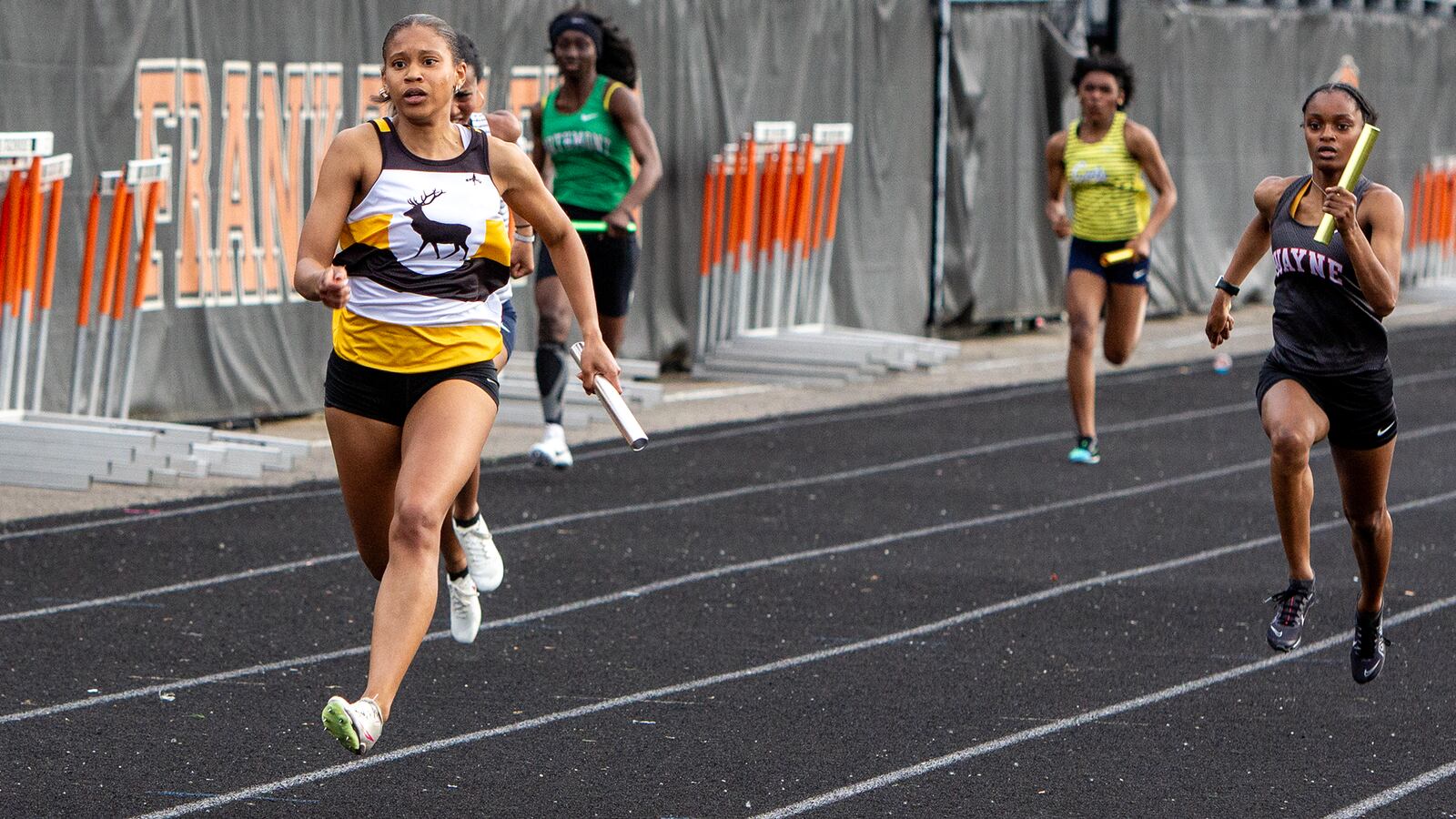 Centerville's Samaria Williams anchors the Elks' winning 4x100 relay team at the GWOC meet Wednesday at Beavercreek High School. Jeff Gilbert/CONTRIBUTED