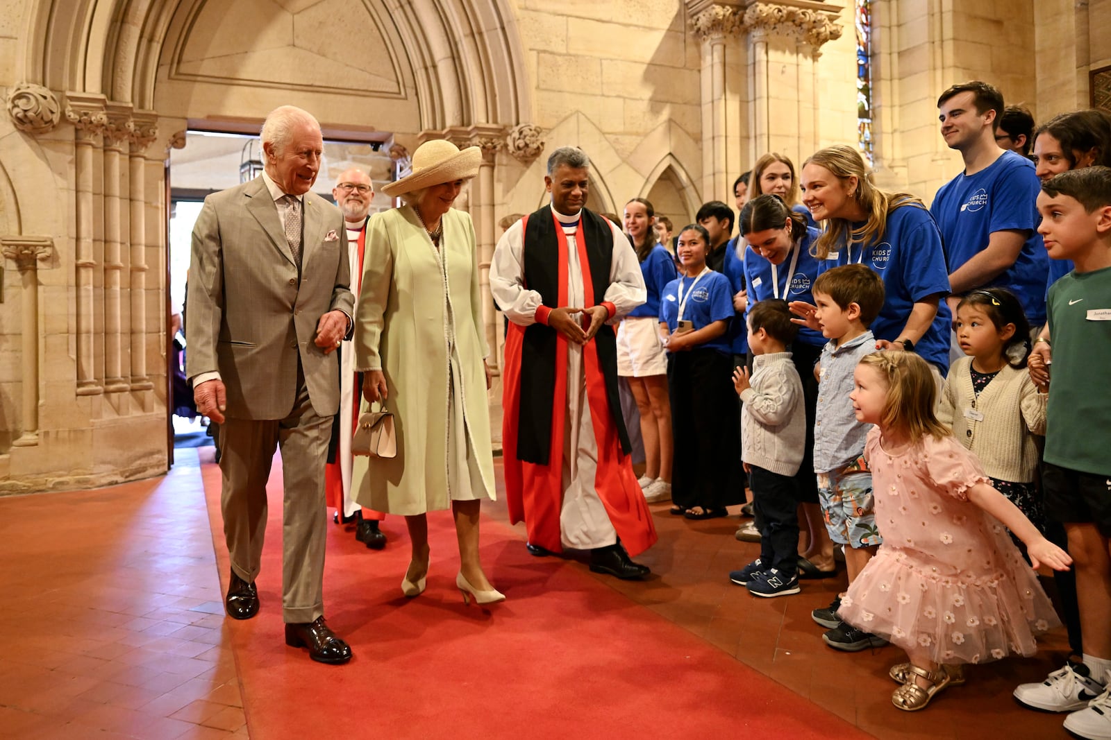 King Charles III, left, and Queen Camilla, center left, arrive for a visit to St Thomas' Anglican Church in Sydney, Sunday, Oct. 20, 2024. (Dean Lewins/Pool Photo via AP)