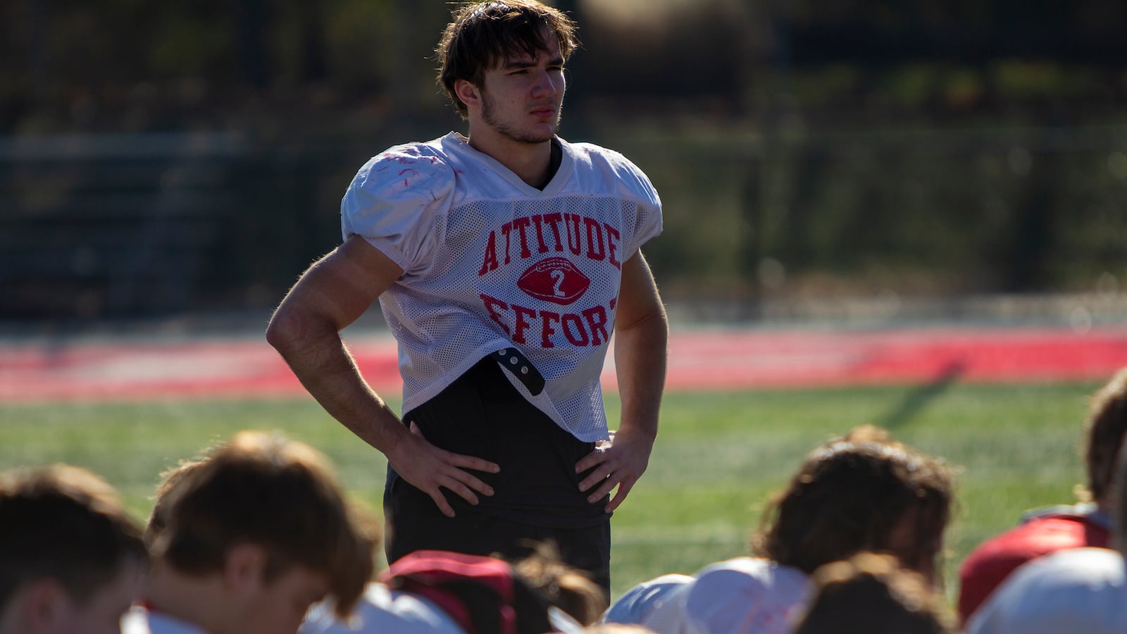 Tippecanoe linebacker Josh Dietz and his teammates listen as head coach Matt Burgbacher talks to the team after Wednesday's practice. Dietz is the only player who started on defense during the 2021 season. CONTRIBUTED/Jeff Gilbert