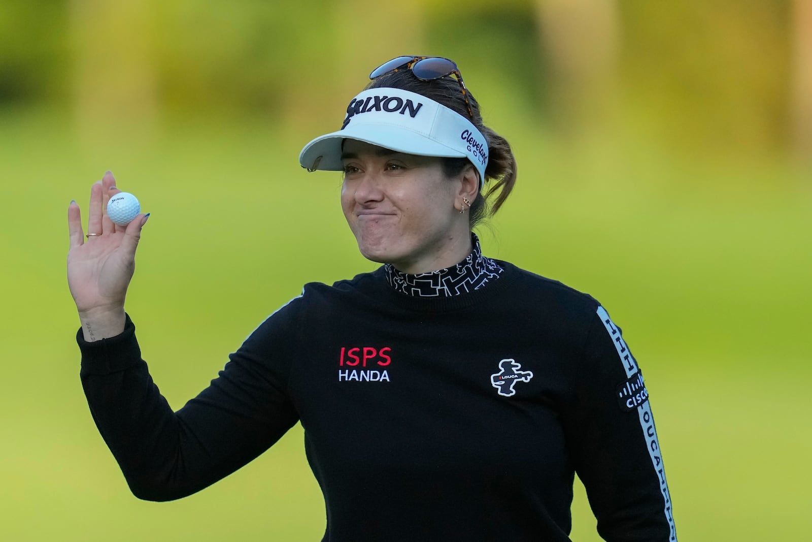 Hannah Green of Australia celebrates on the 18th hole after winning the LPGA Ladies Championship golf tournament at the Seowon Valley Country Club in Paju, South Korea, Sunday, Oct. 20, 2024. (AP Photo/Lee Jin-man)