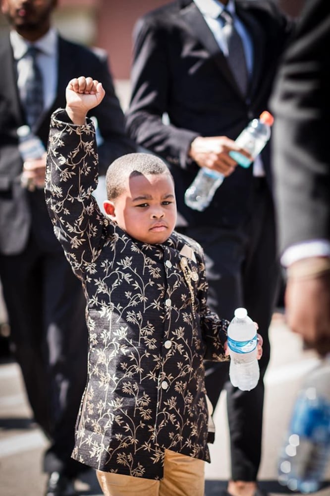 Photos: 300 men in suits march in Dayton