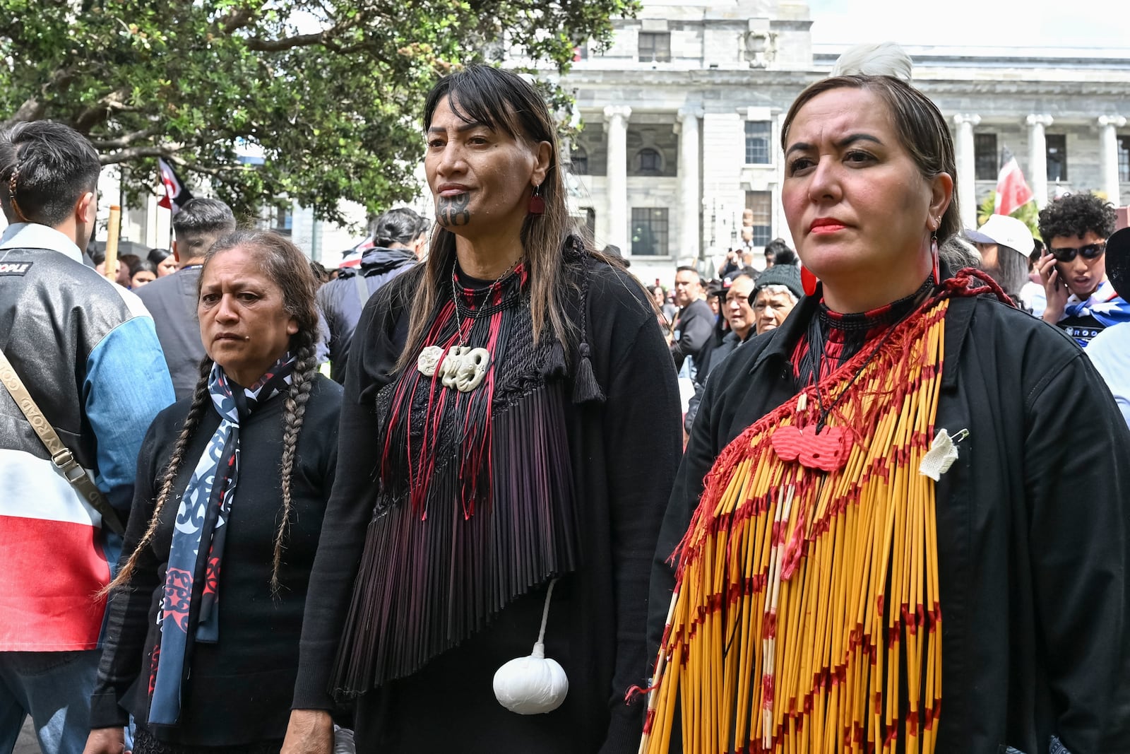 Members of Te Āti Awa, join thousands of people gathered outside New Zealand's parliament to protest a proposed law that would redefine the country's founding agreement between Indigenous Māori and the British Crown, in Wellington Tuesday, Nov. 19, 2024. (AP Photo/Mark Tantrum)