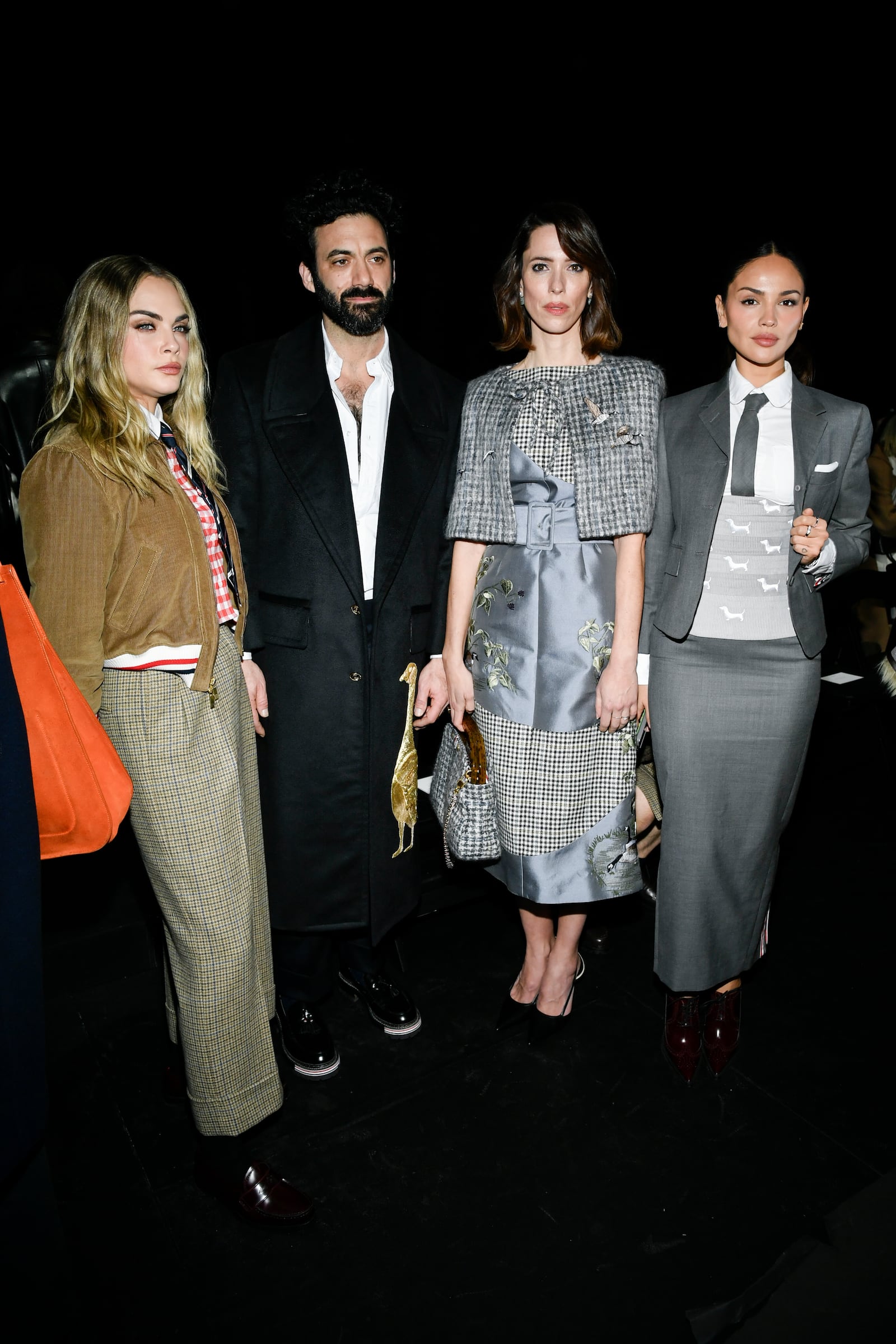 Cara Delevingne, from left, Morgan Spector, Rebecca Hall, and Eiza Gonzalez attend the Thom Browne Fall/Winter 2025 fashion show as part of New York Fashion Week on Tuesday, Feb. 11, 2025, at The Shed in New York. (Photo by Evan Agostini/Invision/AP)