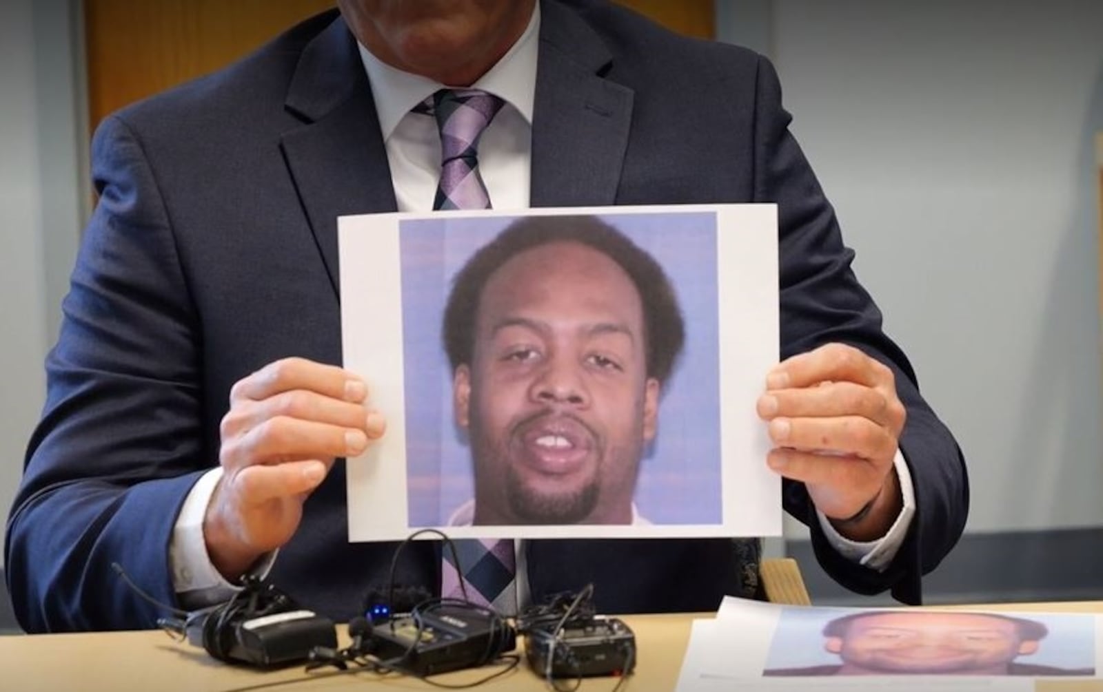 Dayton police Maj. Brian Johns holds a photo from 10 years ago of convicted serial rapist Tiandre Turner on Wednesday, May 3, 2023. Turner was sentenced Wednesday to 44 years in prison for four cold case rapes that happened about a decade ago, but police believe there are more victims and urge them to come forward. CONTRIBUTED