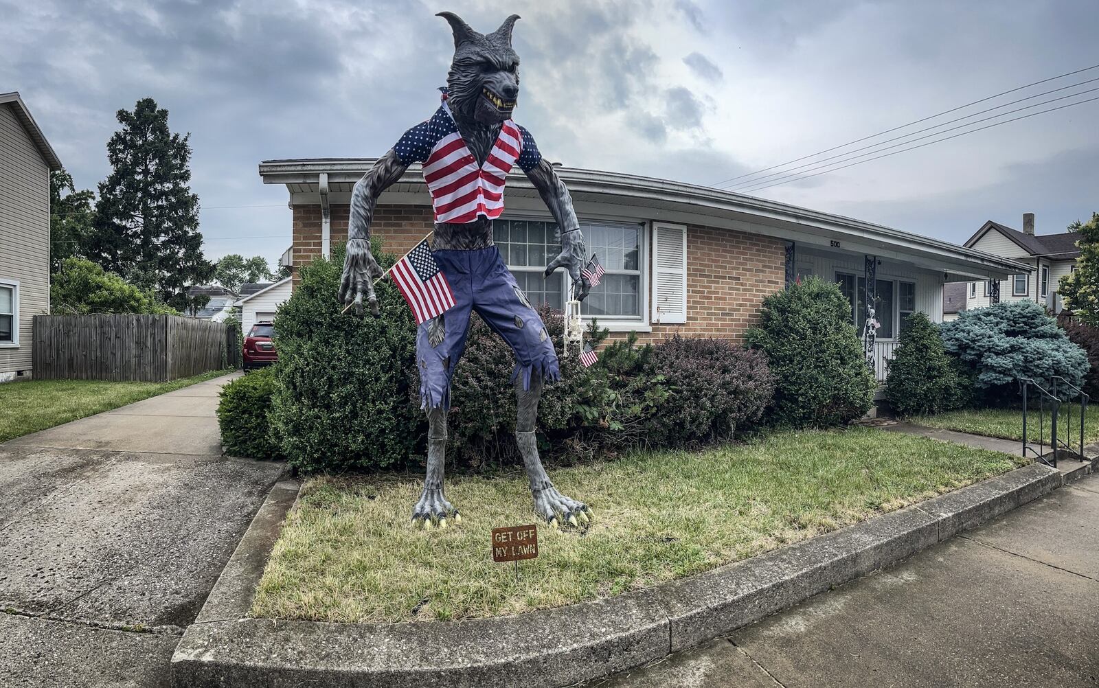 A 10-foot werewolf is in the front yard in Piqua at 500 South Downing Street. JIM NOELKER/STAFF