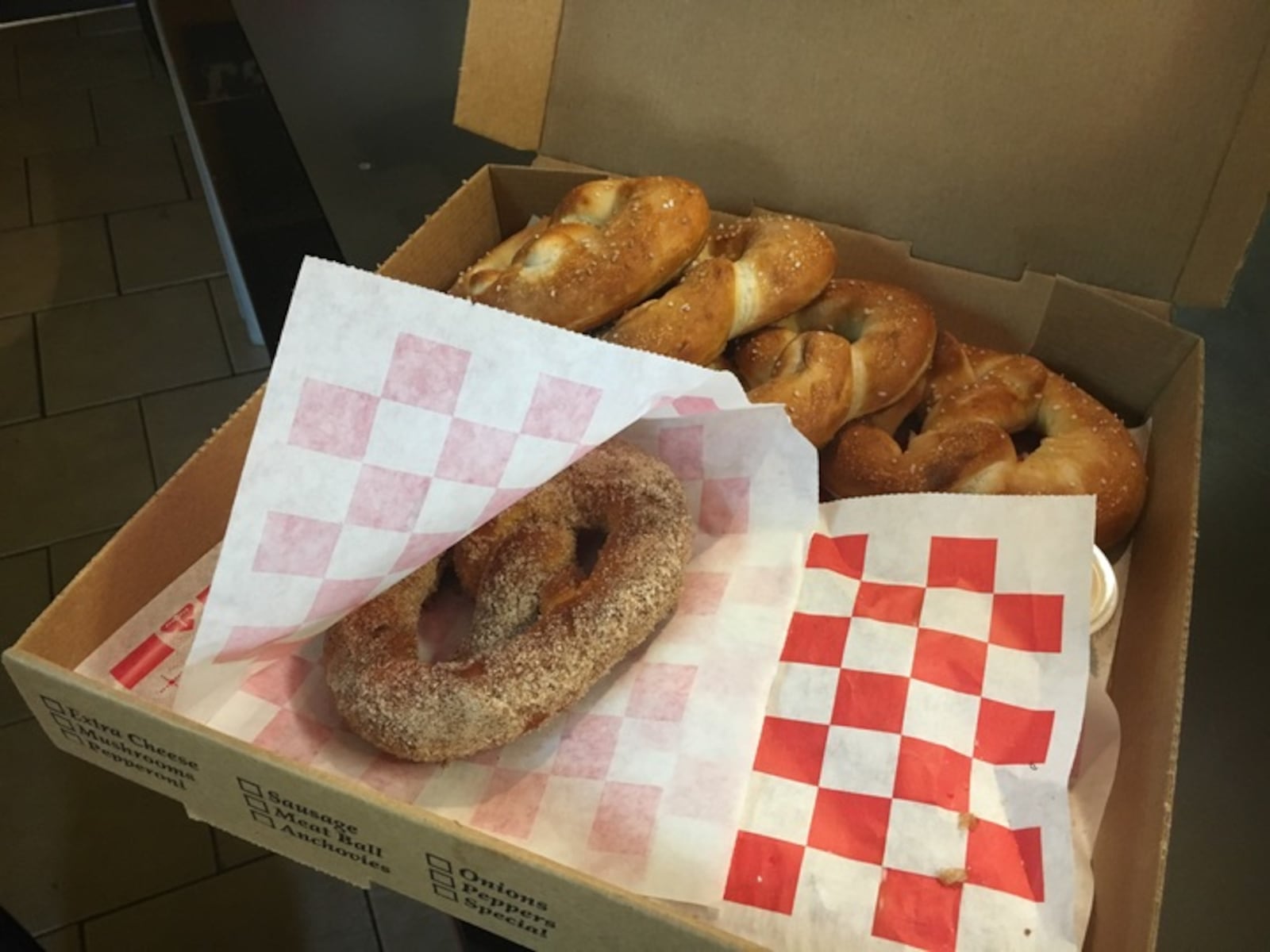 Liberal amounts of cinnamon and sugar go on every dessert pretzel at Beavercreek Pizza Dive.