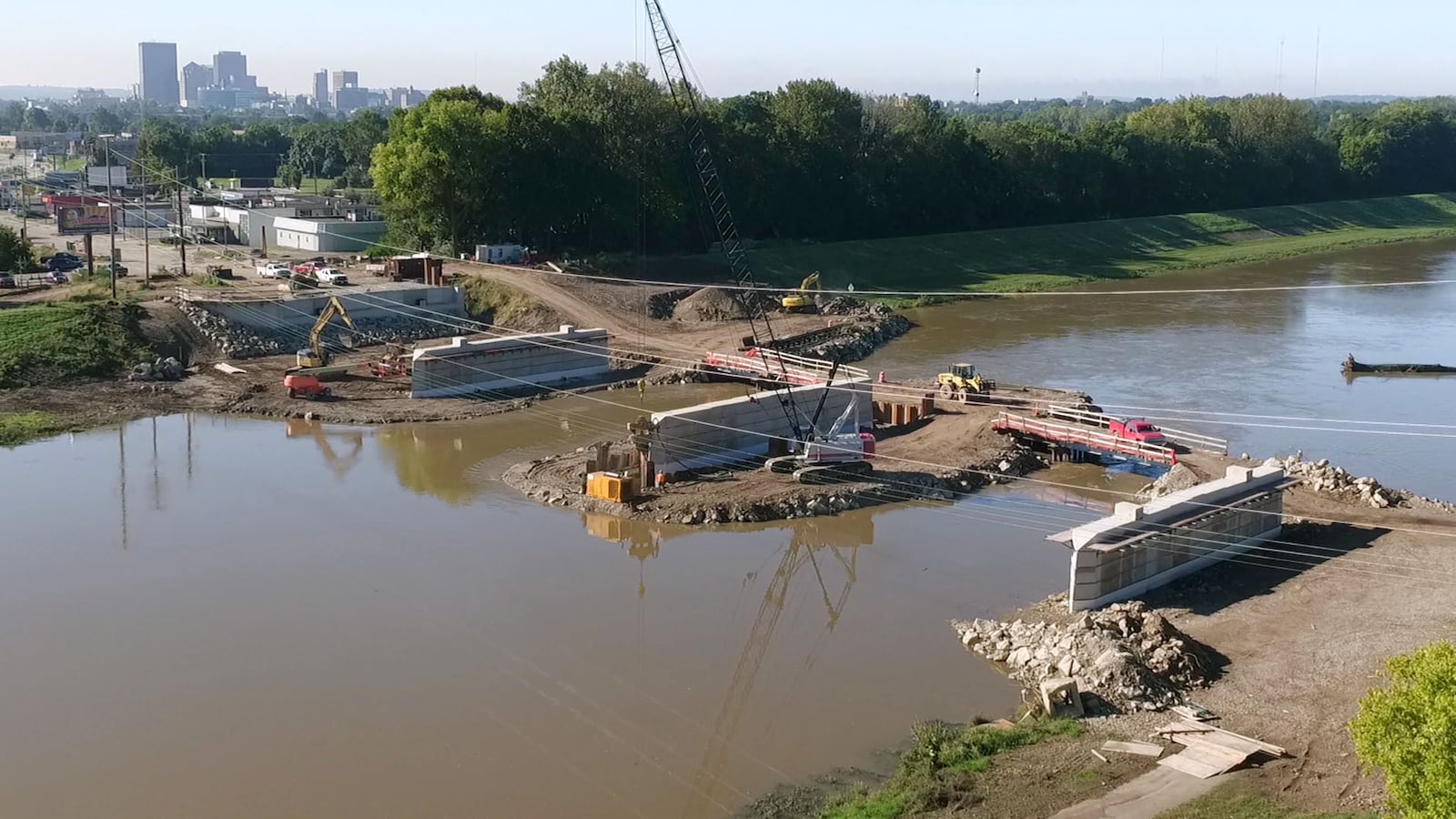 Construction of the new Keowee St. Bridge is in full swing after a few demolition delays in the winter months of early 2018.  The bridge abutments on the banks of the river and all three piers in the water have been completed according to the Montgomery County Engineers Office which is managing the $8.8 million project.  The next step is the placing of 36 beams across the pier spans in October. The beam work is expected to take about 8 days.  The project is on schedule says Cathy Peterson, Director of Communication for Montgomery County, and is expected to be completed in September of 2019.  TY GREENLEES / STAFF