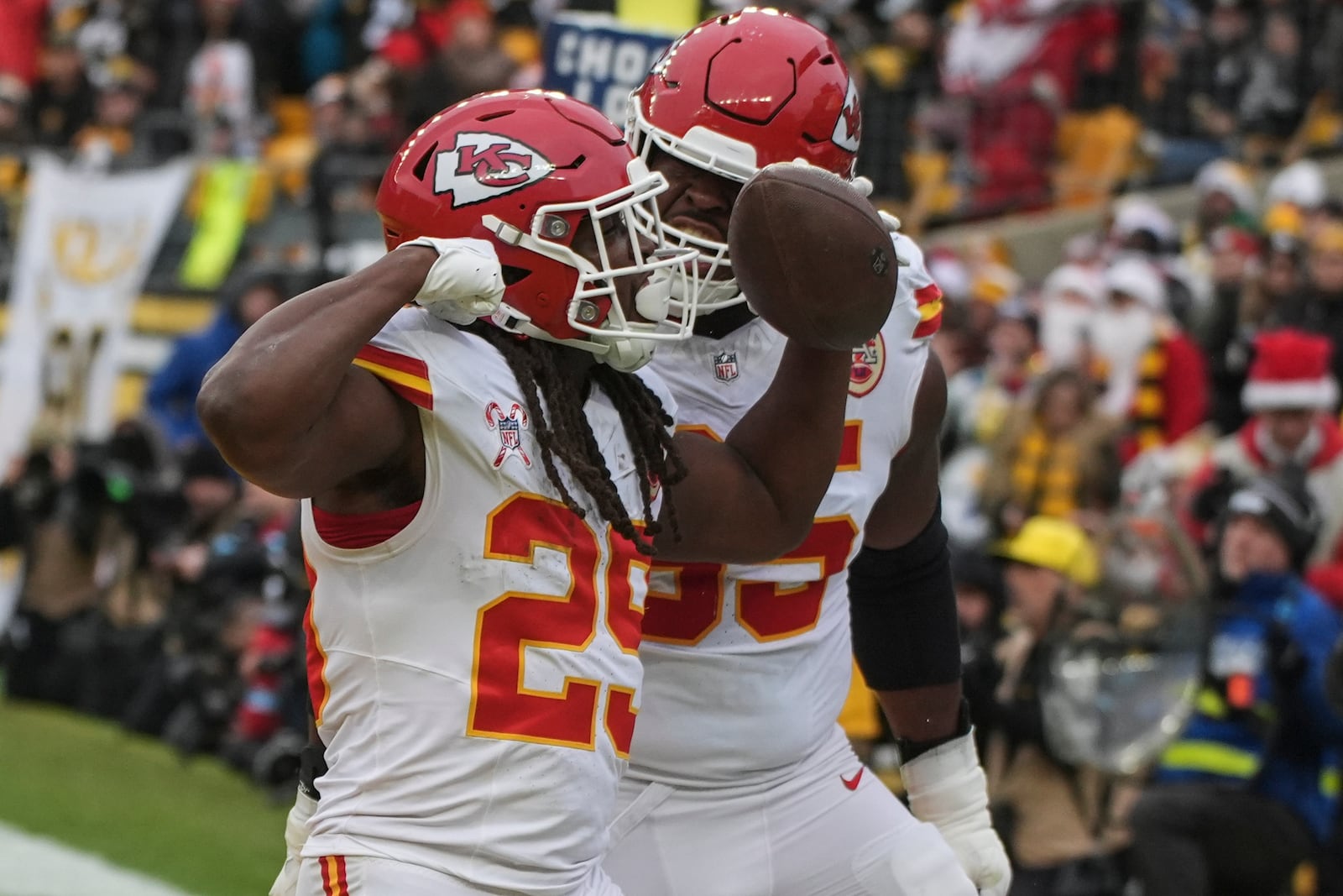 Kansas City Chiefs running back Kareem Hunt (29) celebrates his touchdown against the Pittsburgh Steelers during the second half of an NFL football game, Wednesday, Dec. 25, 2024, in Pittsburgh. (AP Photo/Gene J. Puskar)