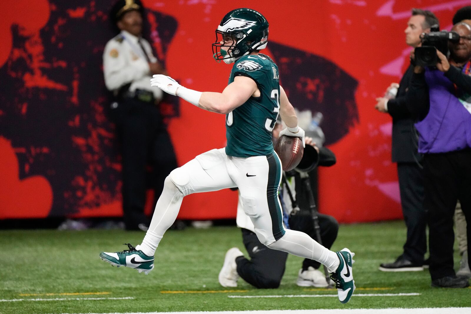 Philadelphia Eagles defensive back Cooper DeJean (33) runs into the end zone for a touchdown after intercepting a pass during the first half of the NFL Super Bowl 59 football game against the Kansas City Chiefs, Sunday, Feb. 9, 2025, in New Orleans. (AP Photo/Stephanie Scarbrough)