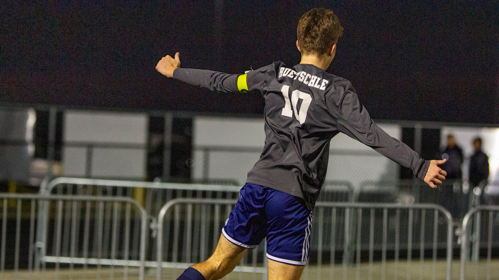 Oakwood senior John Ruetschle points to his back as he celebrates his second goal during Wednesday night's 3-0 Division II regional semifinal victory over Bellbrook at Beavercreek High School. Jeff Gilbert/CONTRIBUTED